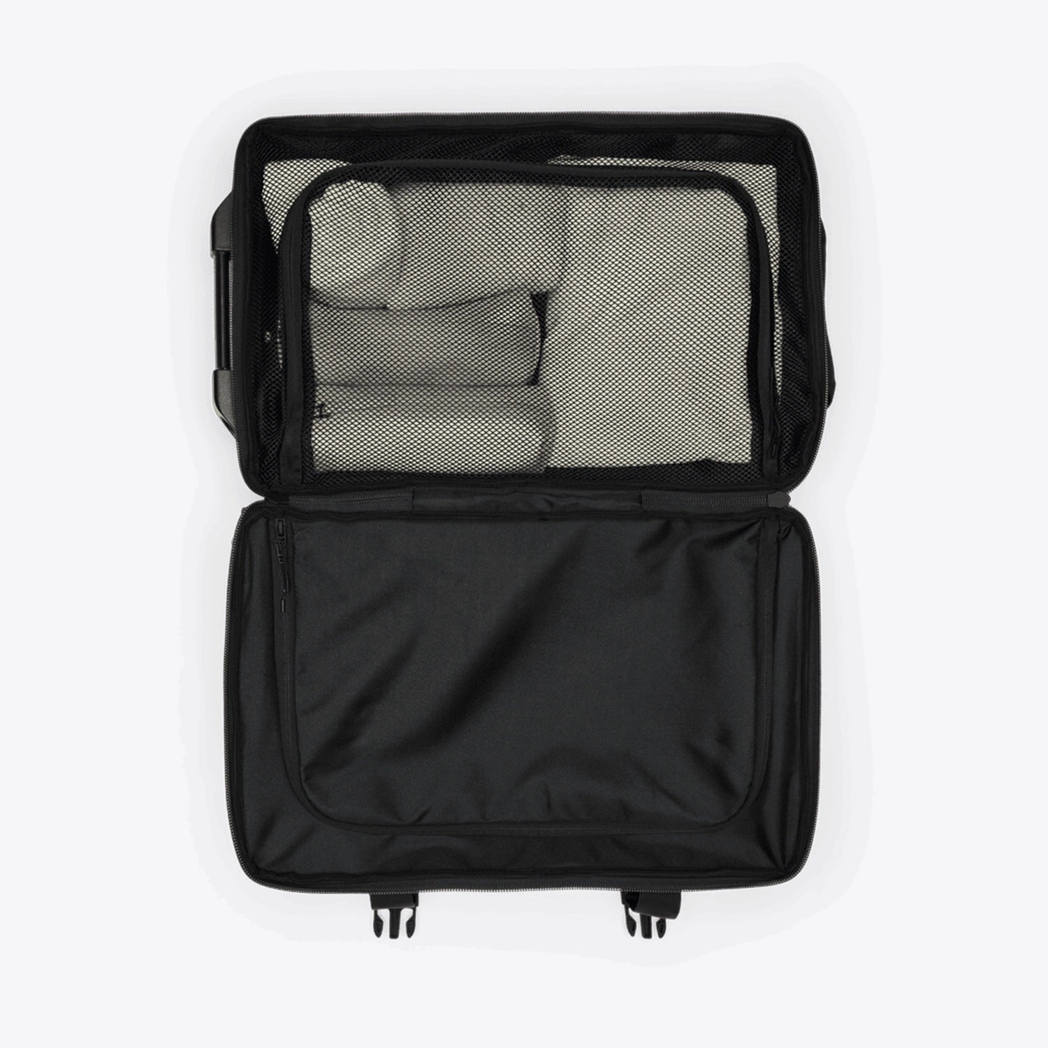 Texel Cabin Bag Small Blue Dusk Suitcase open showing organized packing with mesh pockets and compartments.