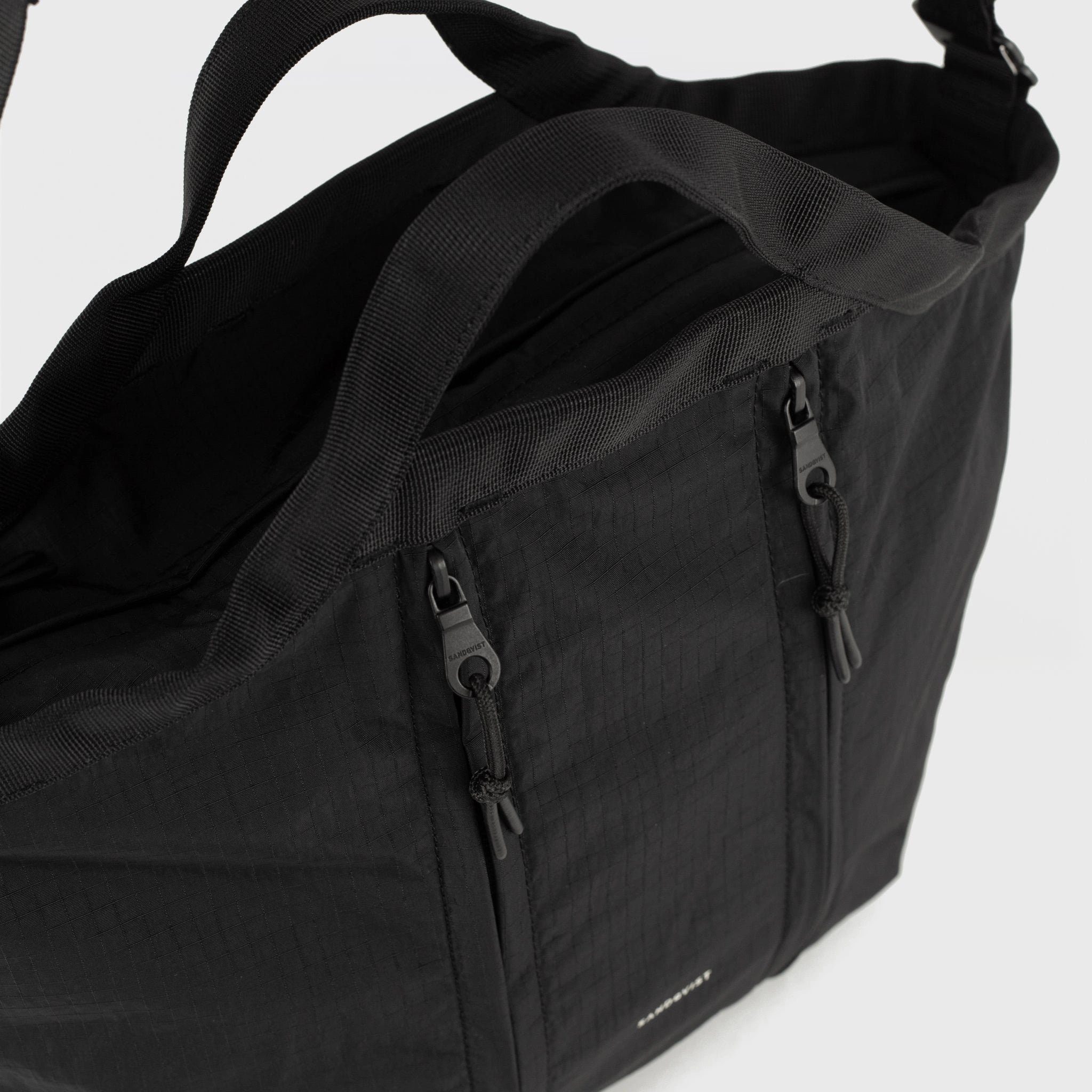 Grid Crossbody Bag Black Shoulder Bag featuring adjustable straps and durable nylon construction.