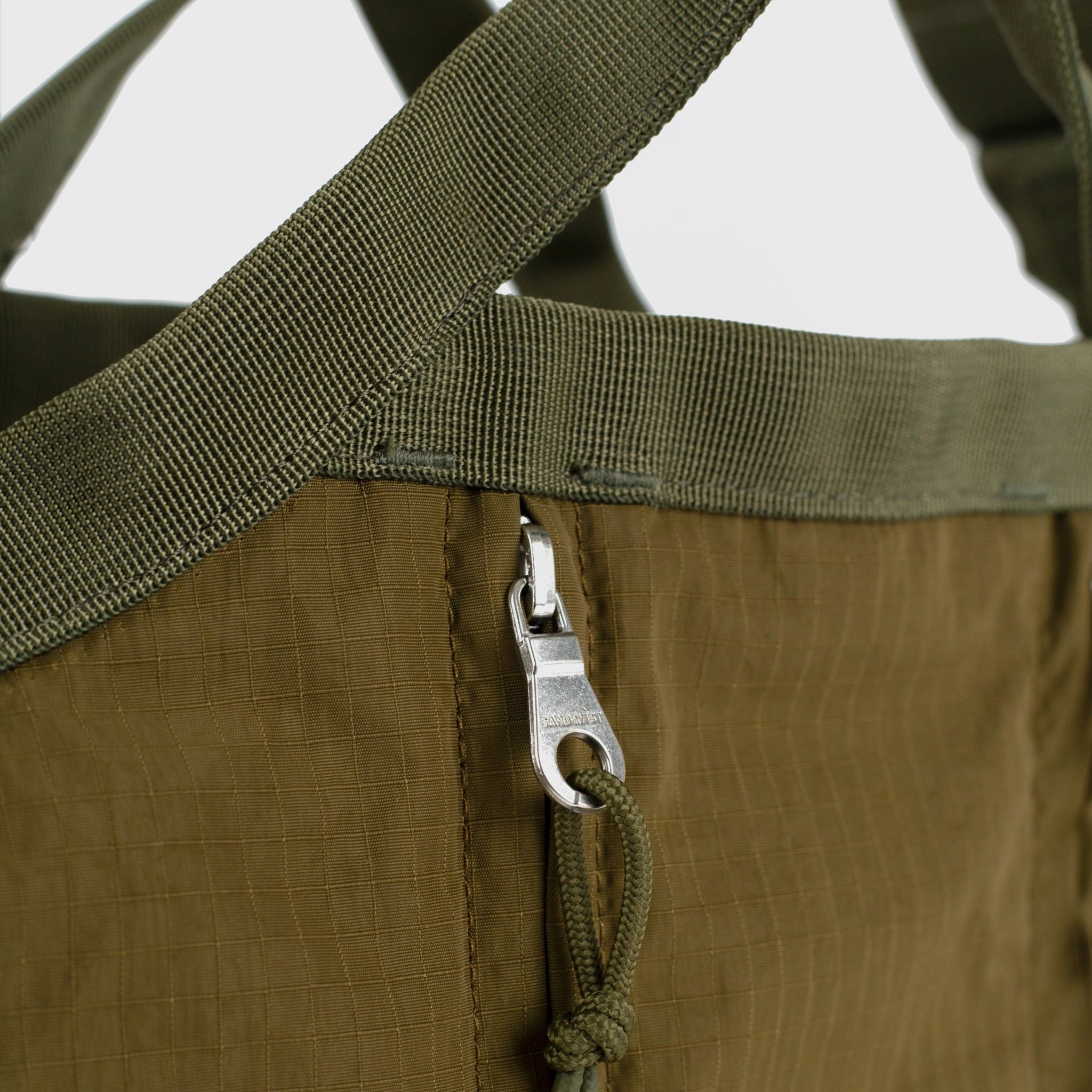 Grid Crossbody Bag Olive Shoulder Bag showing adjustable strap and YKK zippers for durability
