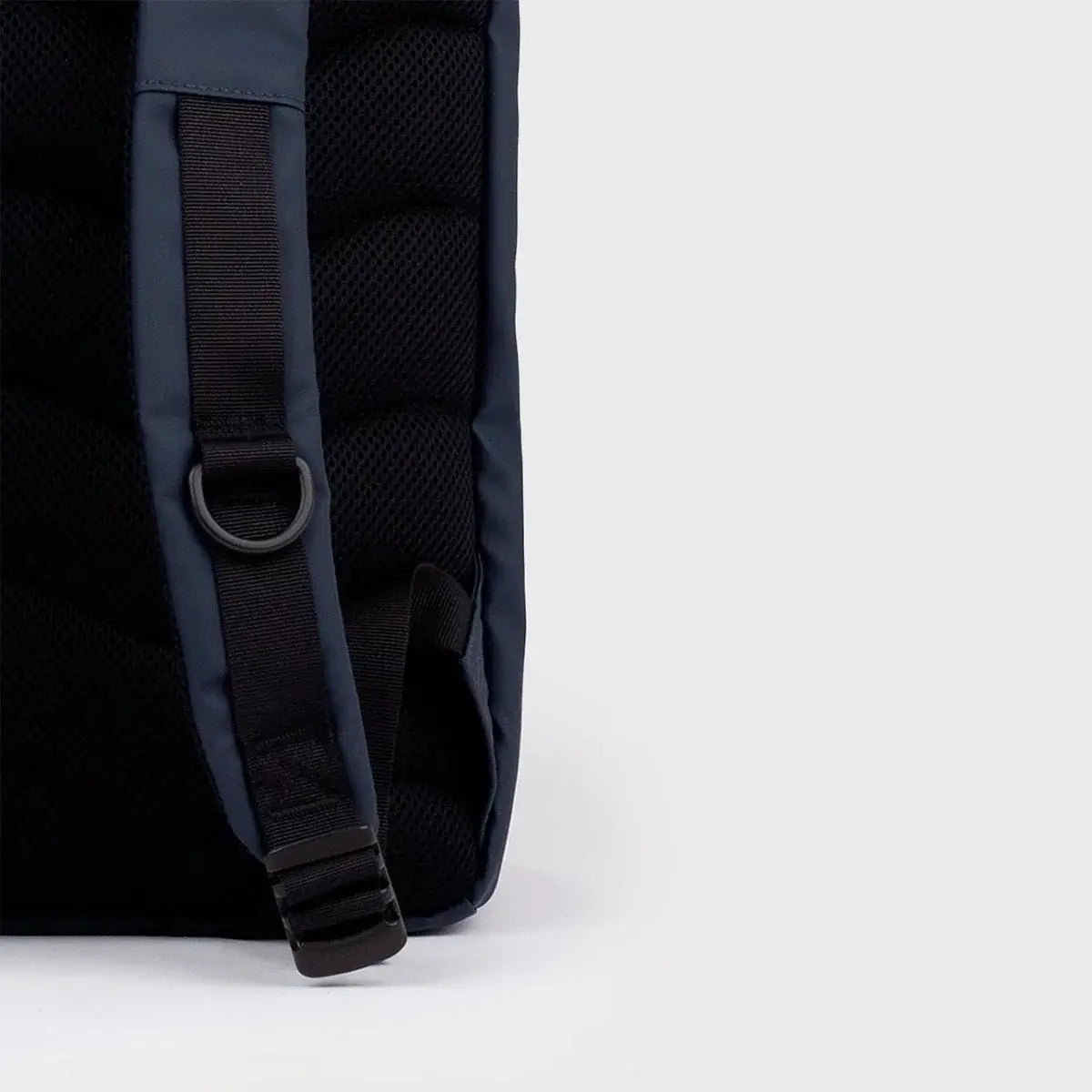 Stream Slim Rolltop L Navy Backpack showing padded shoulder strap and textured back panel for comfort.