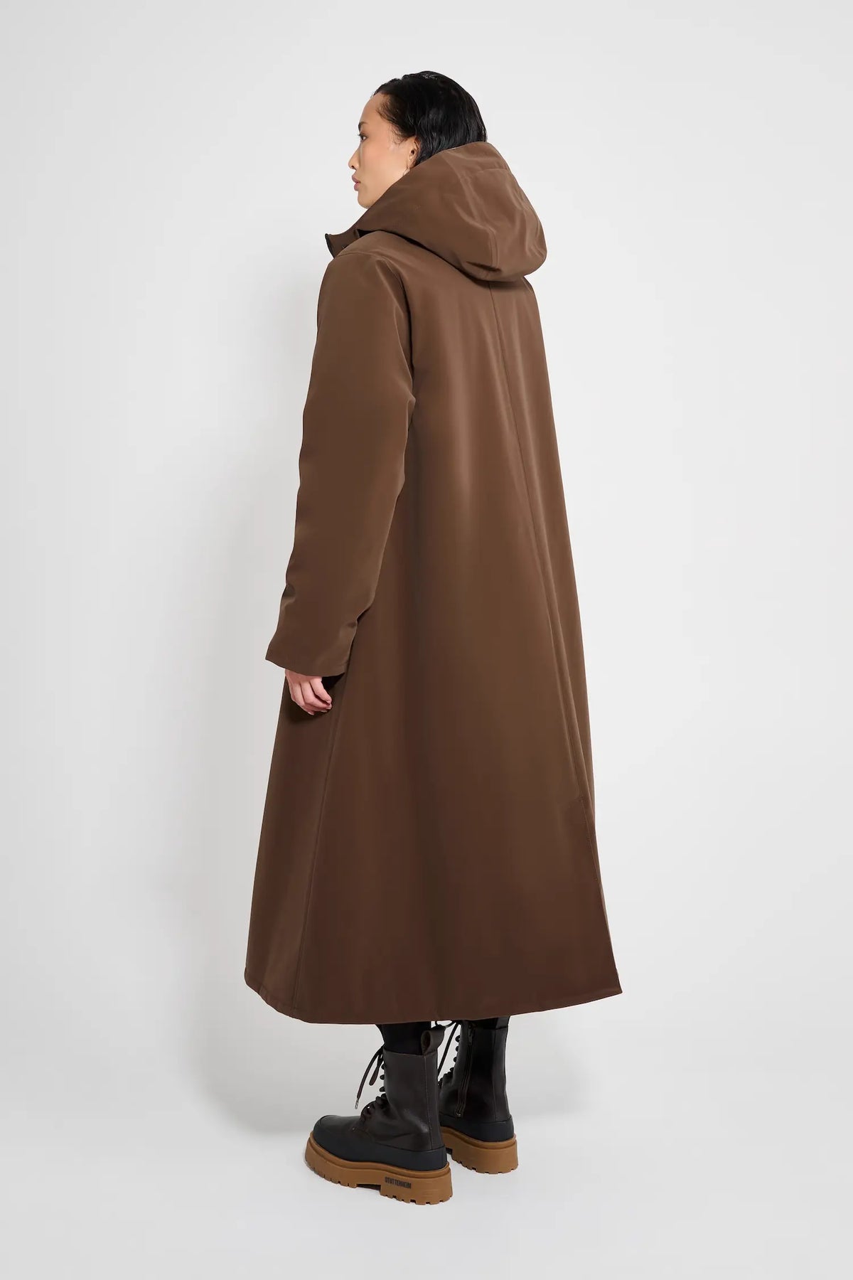 Mosebacke Long Matte Dark Brown Winter Coat shown from the back, featuring an adjustable hood and A-line silhouette.