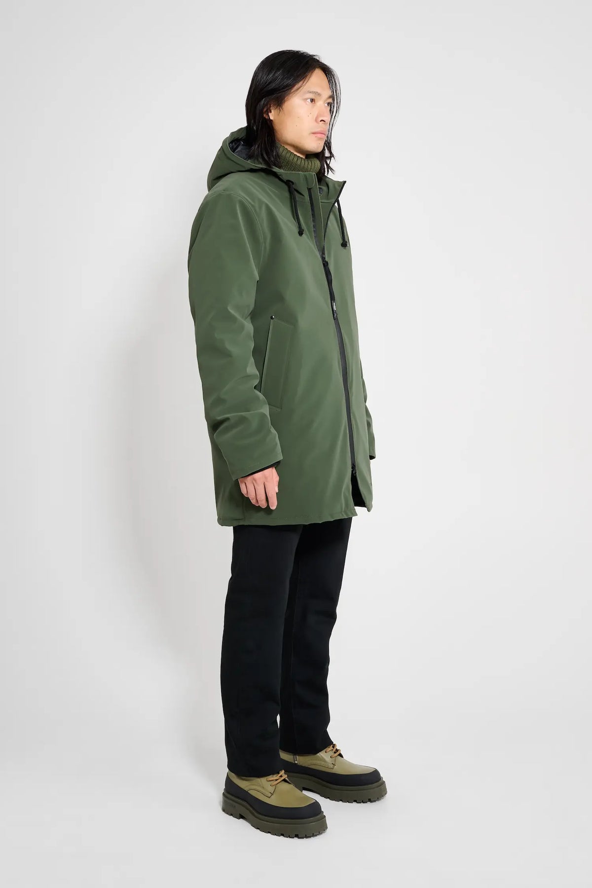 Stockholm Matte Green Winter Coat worn by model, showcasing its oversized fit and waterproof design.