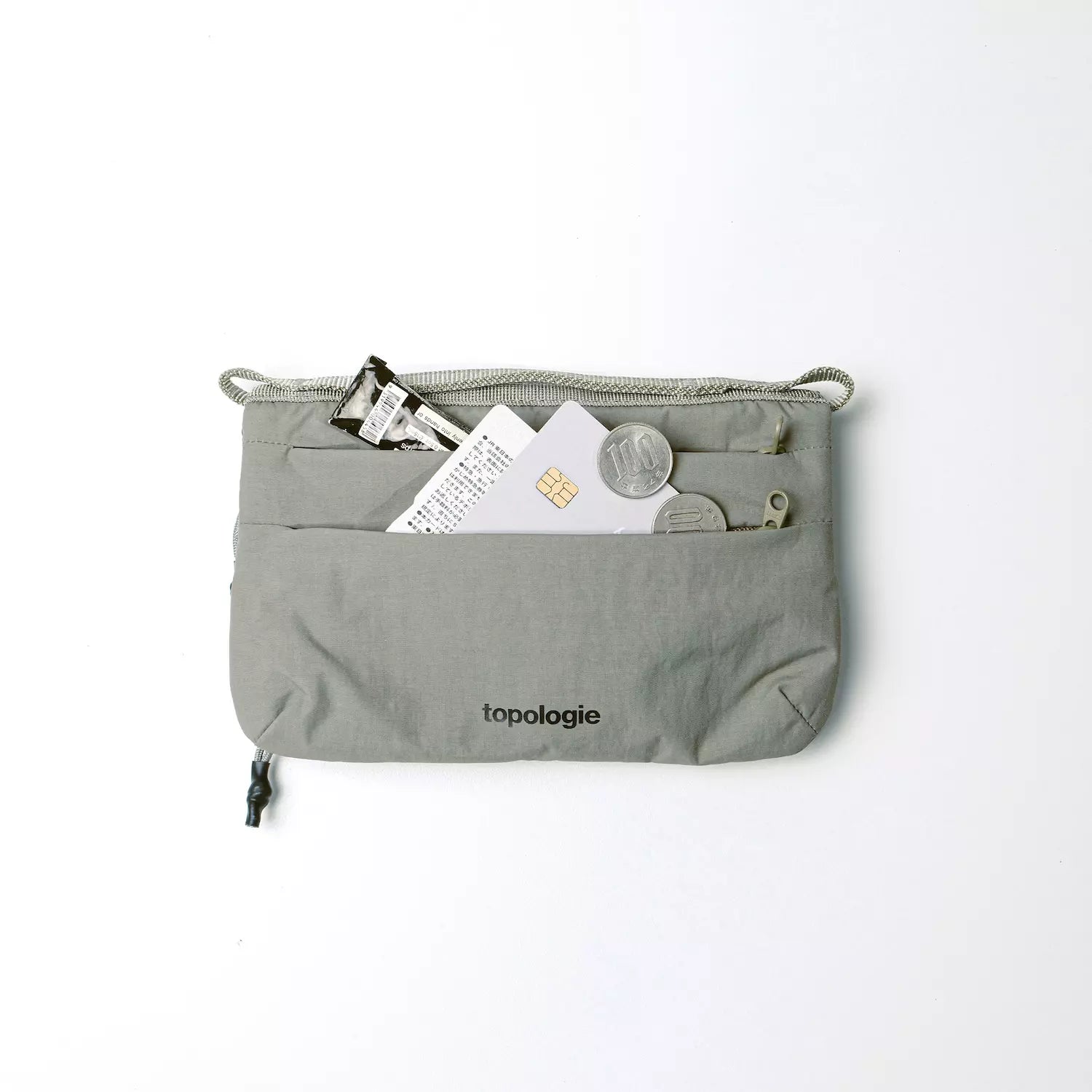 Phone Sacoche 90 Purple Washed Silk Nylon Bag in gray with items inside, showcasing practical design features.
