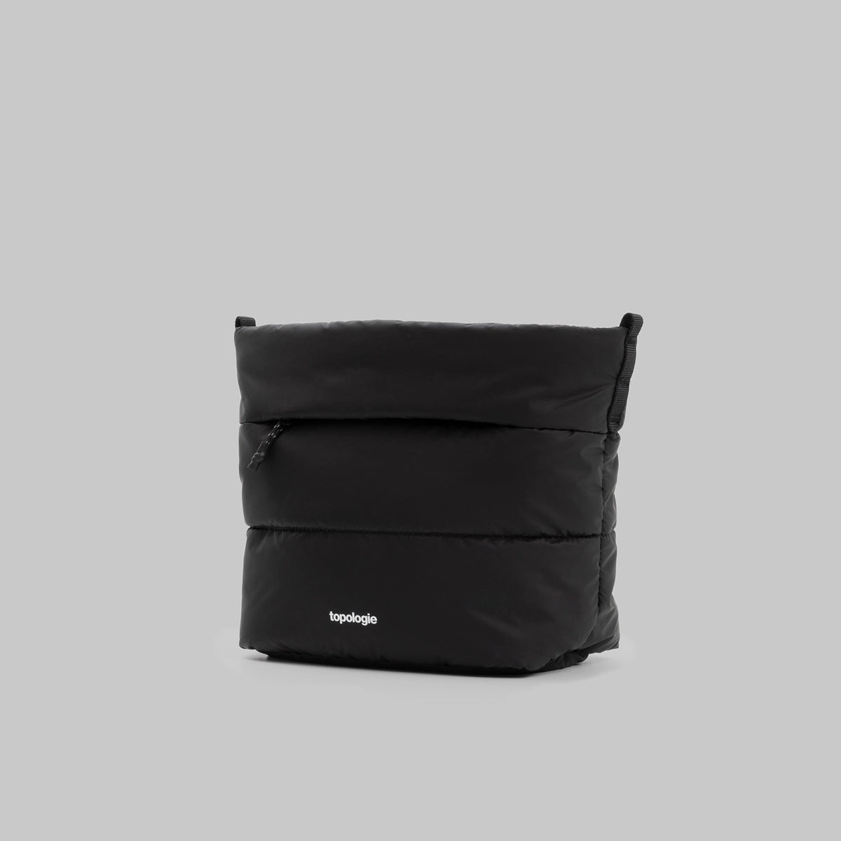 Besace Black Silky Peach Bag in sleek black design, featuring zipper closure and inside compartments.