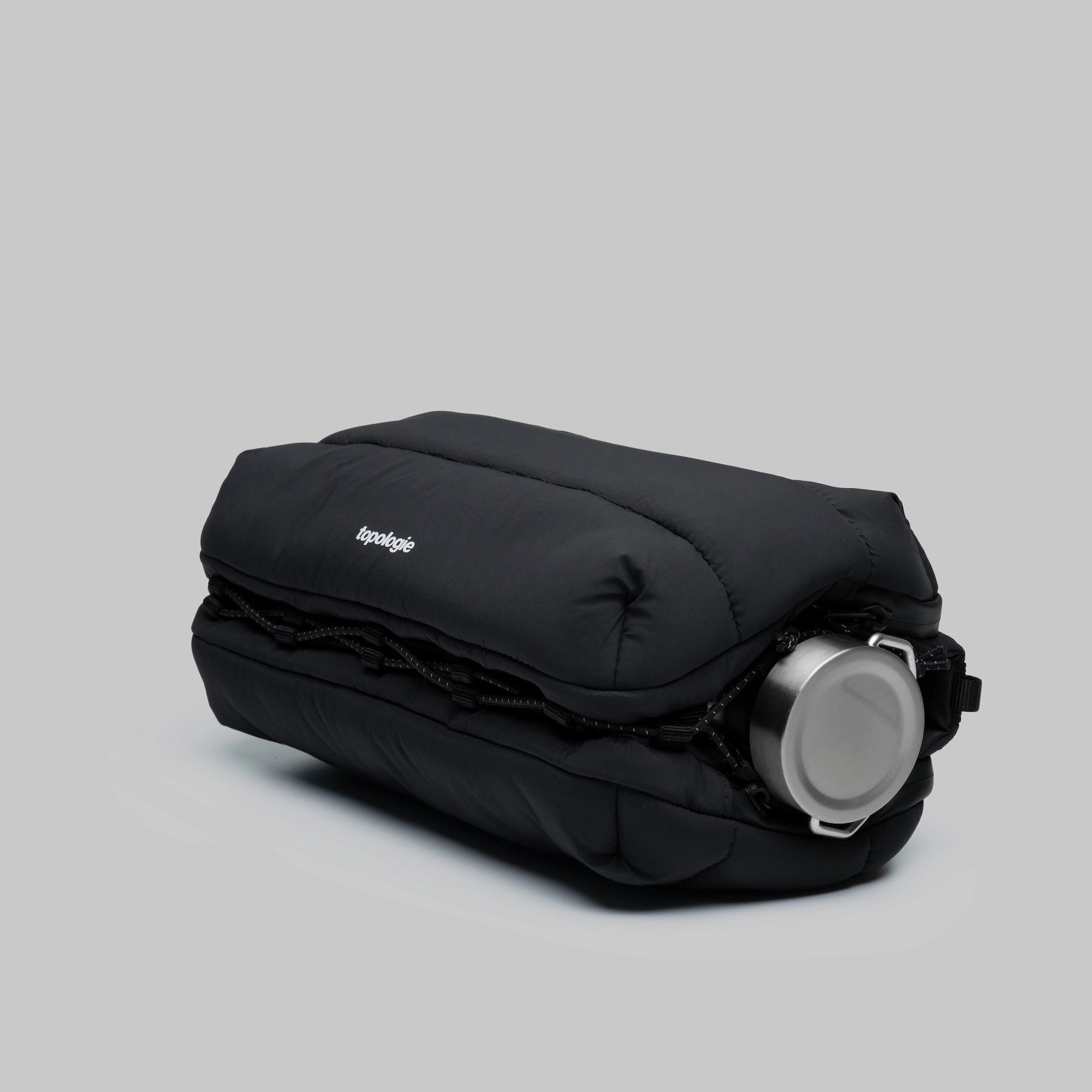 Bottle Sacoche Large Black Silky Peach Bag with water bottle in a stylish design.