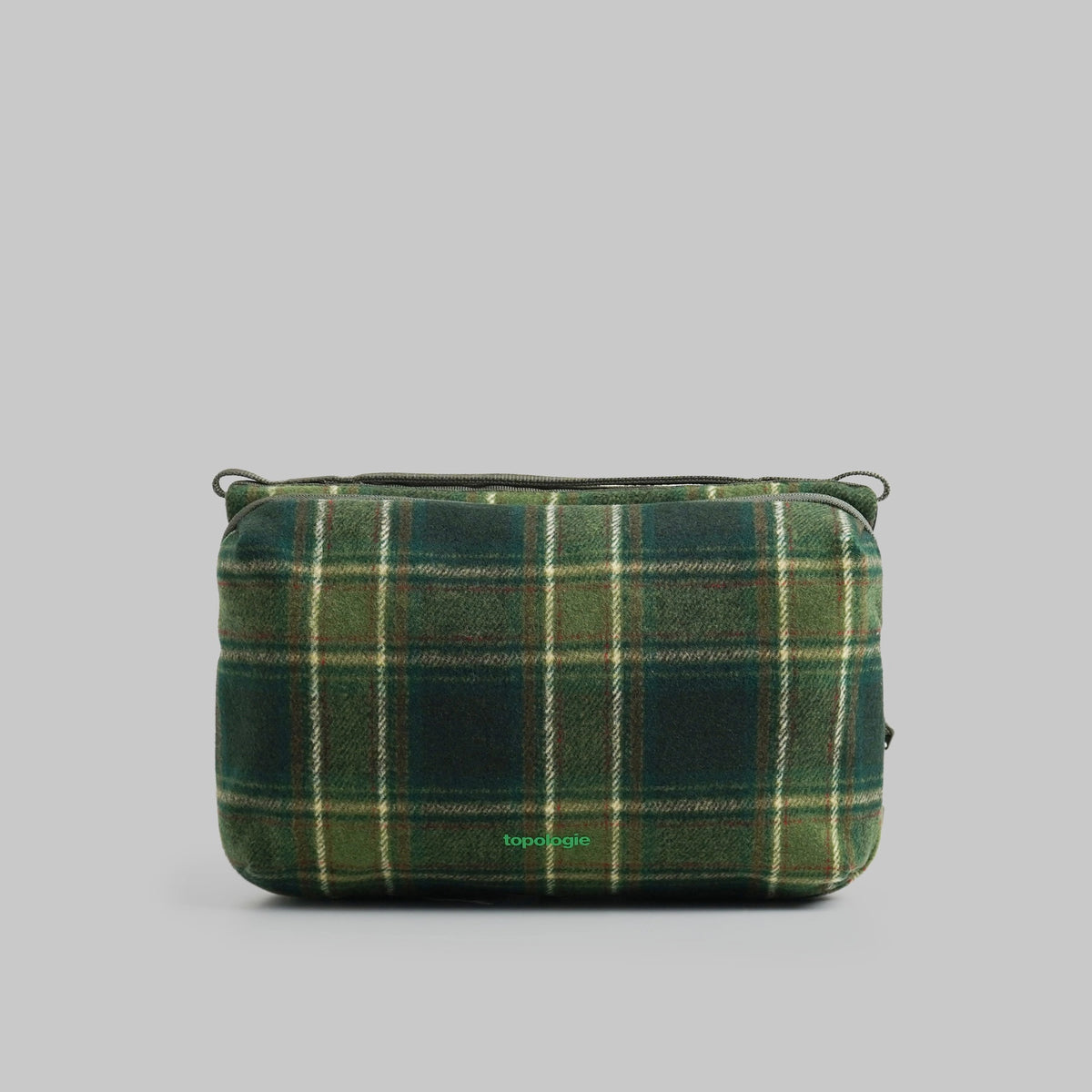 Bottle Sacoche Large Green Check Wool Bag in green check pattern with zipper compartments.