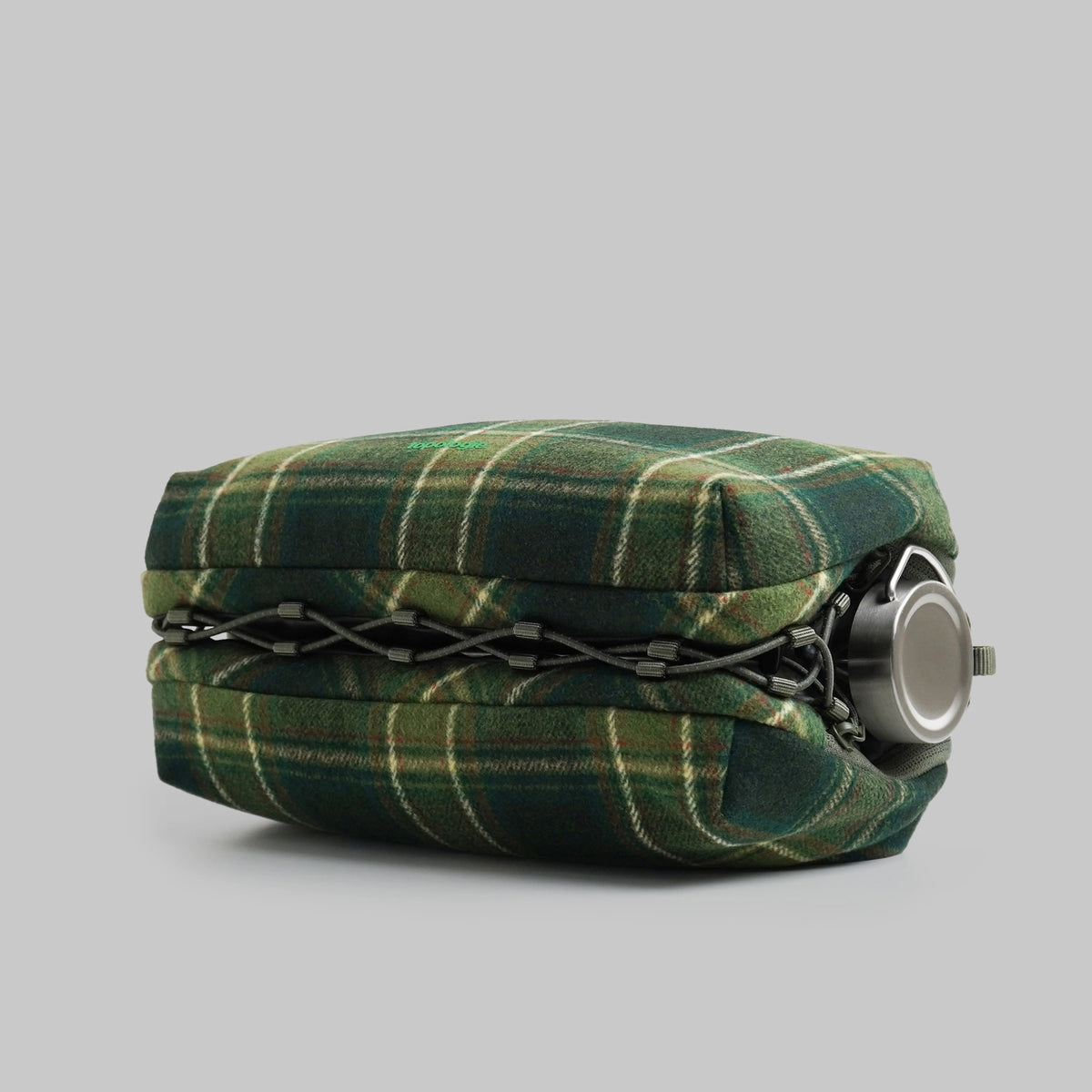 Bottle Sacoche Large Green Check Wool Bag side view showcasing the water repellent fabric and elastic cord.