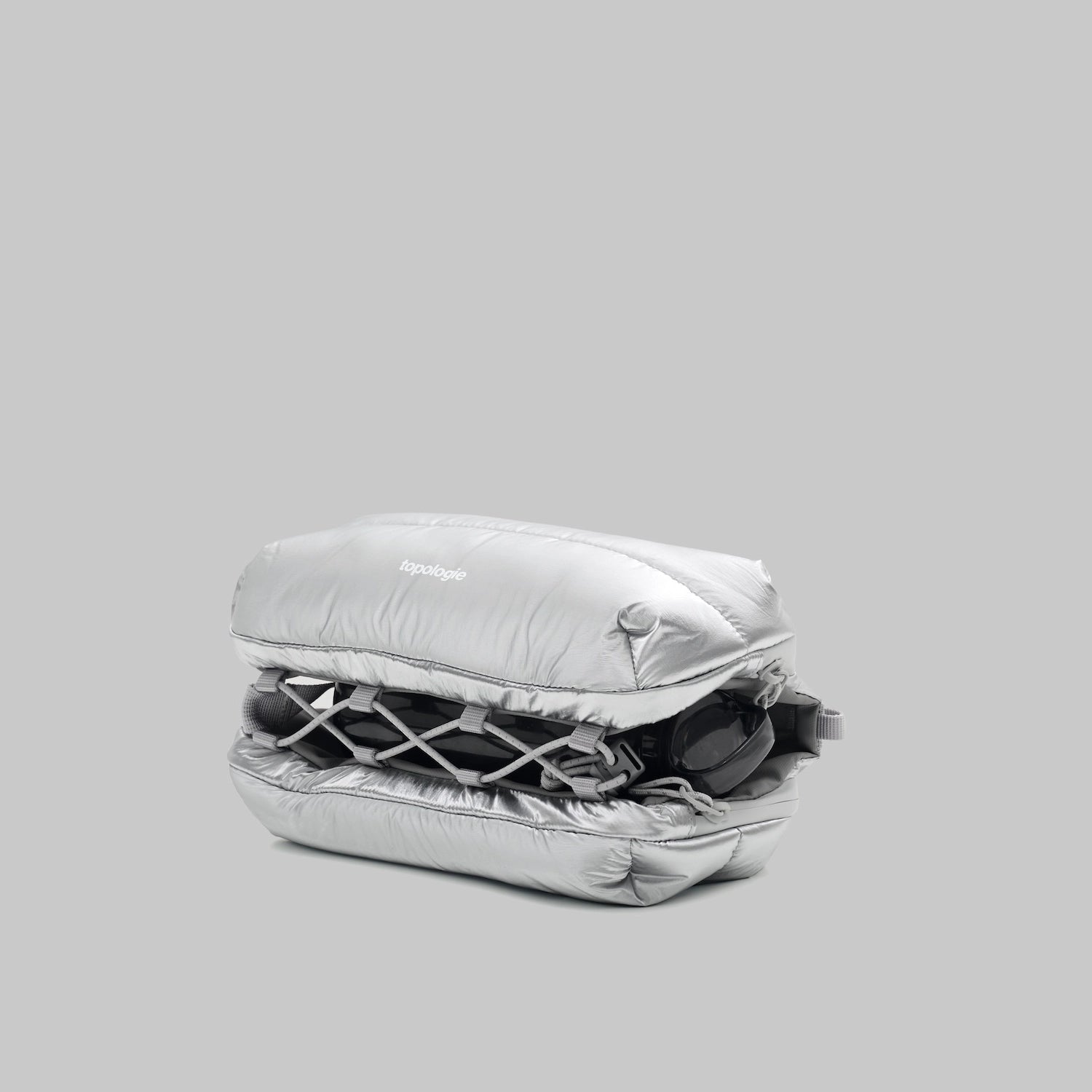 Bottle Sacoche Medium Chrome Space Coated Bag shown in compact design with water repellent fabric, zipped compartments.