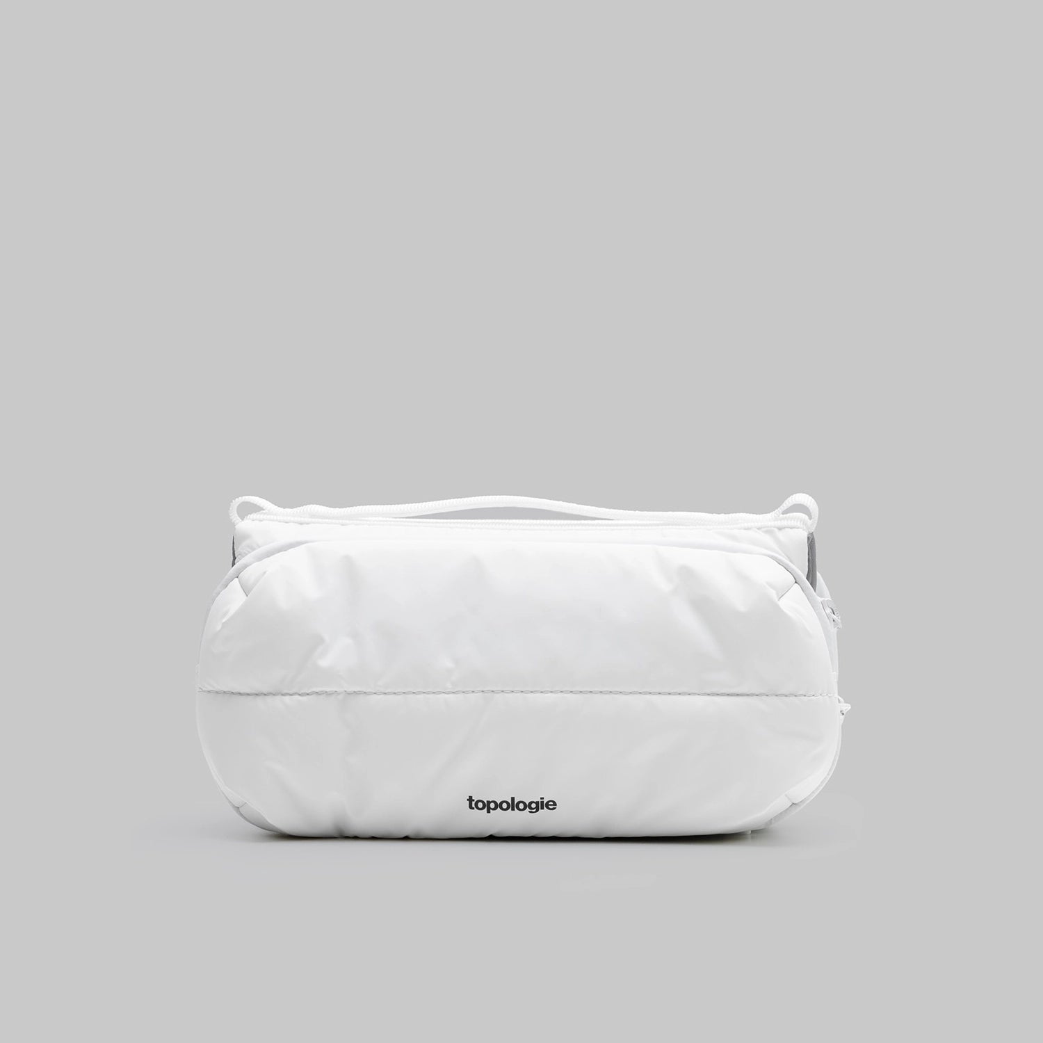Bottle Sacoche Medium Ecru Matt Coated Bag in white with a sleek design and Topologie logo visible.