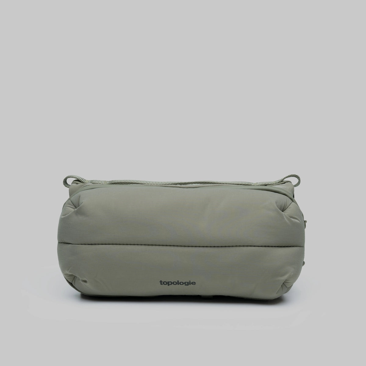 Bottle Sacoche Medium Moss Silky Peach Bag in water repellent recycled nylon, featuring zipped compartments.