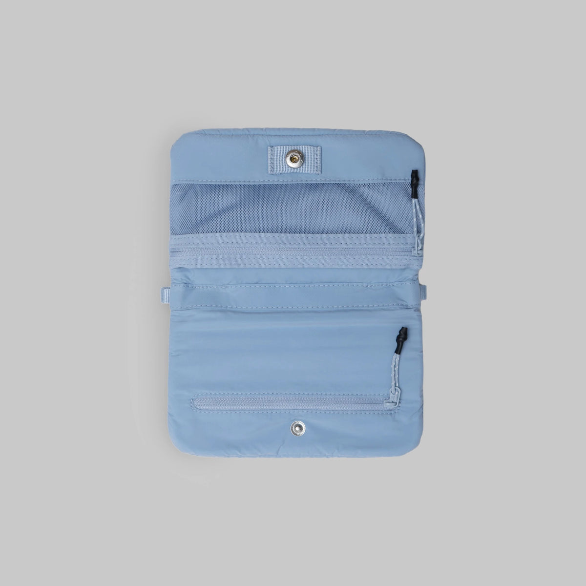 Phone Sacoche 90 Chambray Silky Peach Bag interior with multiple zipped compartments in light blue color.