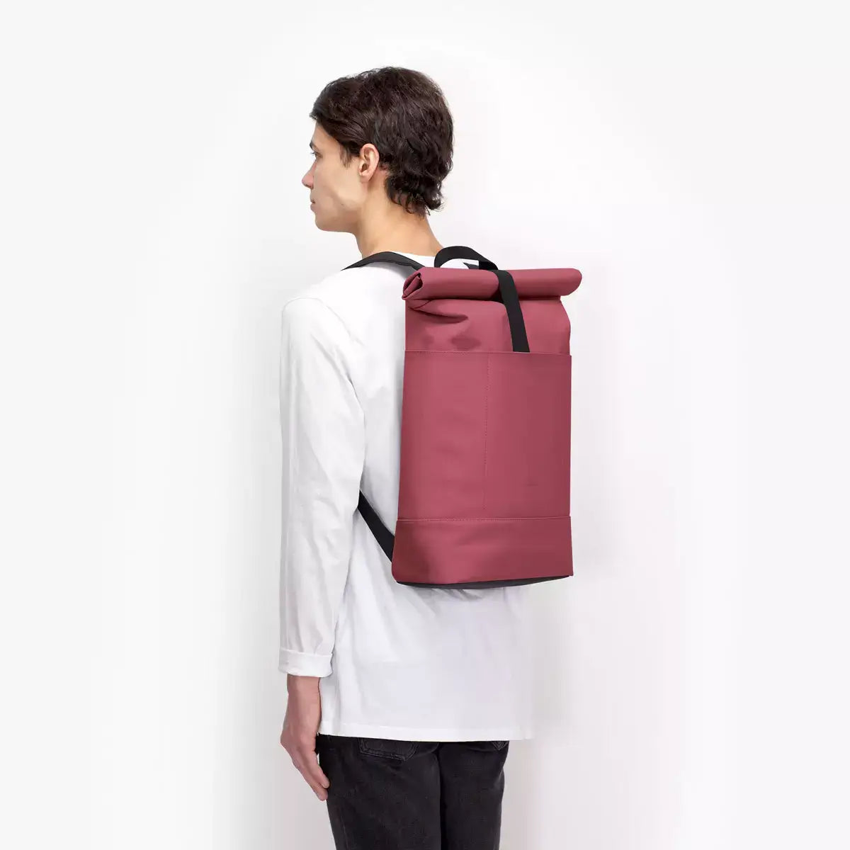 Hajo Lotus Infinity Burgundy Backpack worn by a person, showcasing its sleek design and durable material.