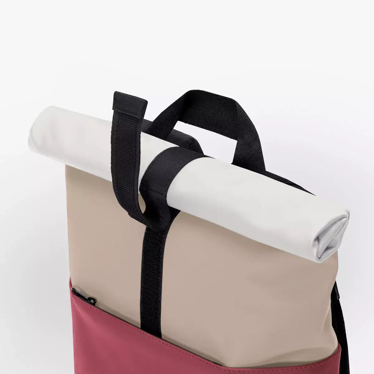 Hajo Lotus Infinity Sand Burgundy Backpack with rolled top and black straps for easy carrying.