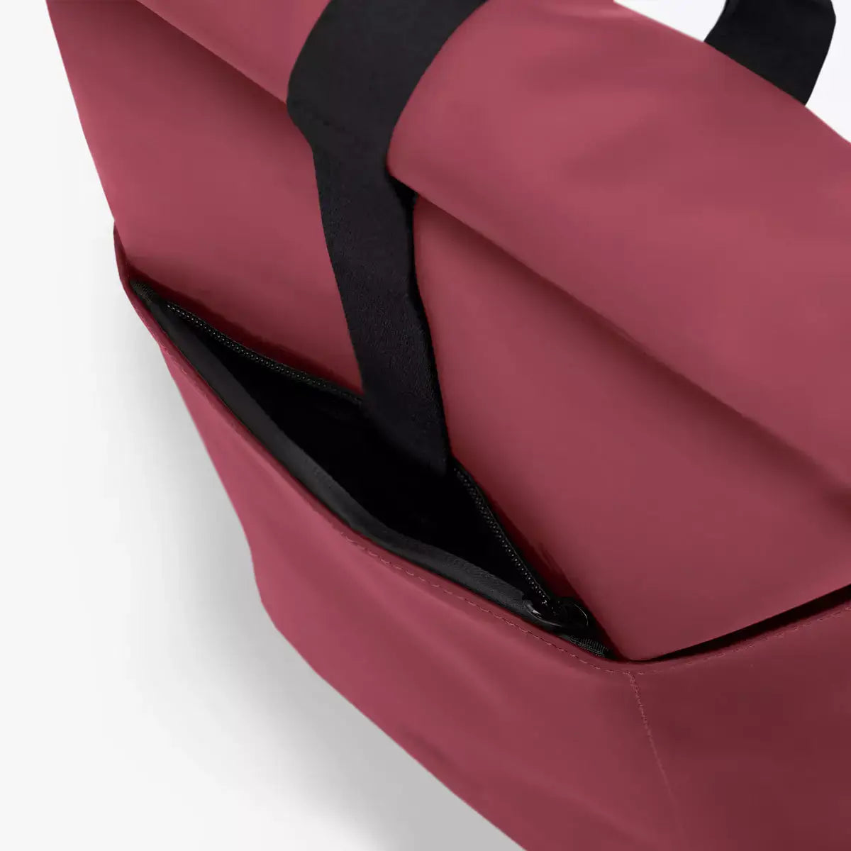 Hajo Mini Lotus Infinity Burgundy Backpack showing the exterior side pocket and waterproof material.