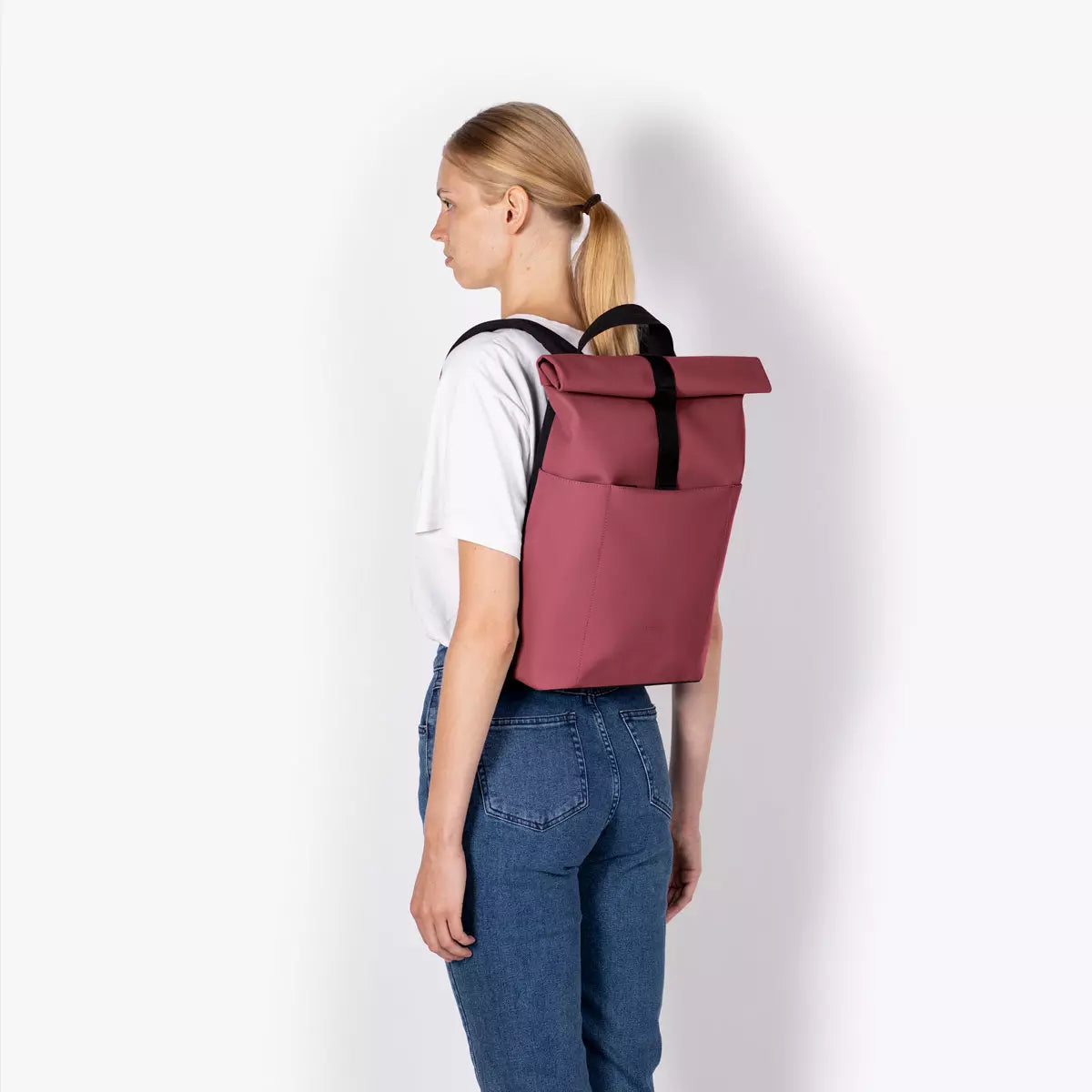 Hajo Mini Lotus Infinity Burgundy Backpack worn by woman, showcasing its stylish design and functionality.
