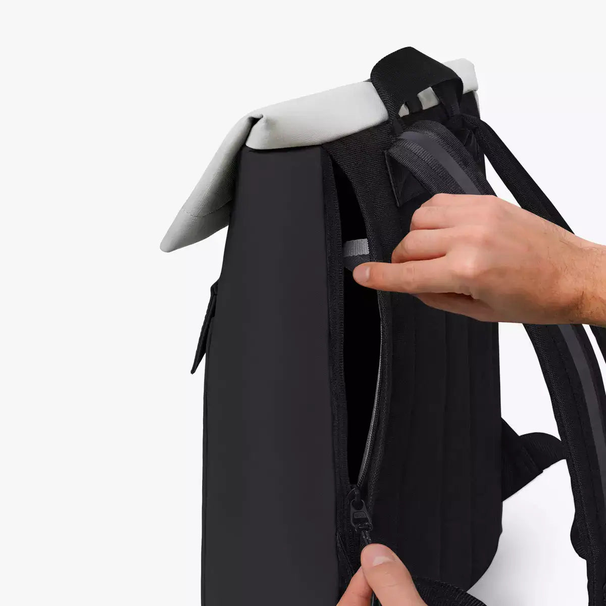 Jannik Medium Aloe Black Light Grey Backpack showcasing zipper feature and padded straps.
