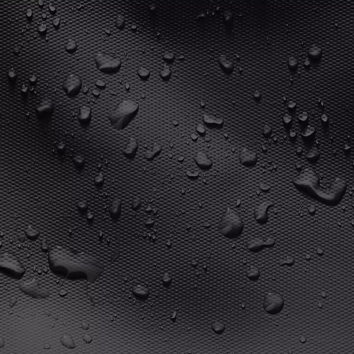 Close-up of waterproof black fabric with droplets, showcasing the durability of Jannik Medium Aloe Black Light Grey Backpack.