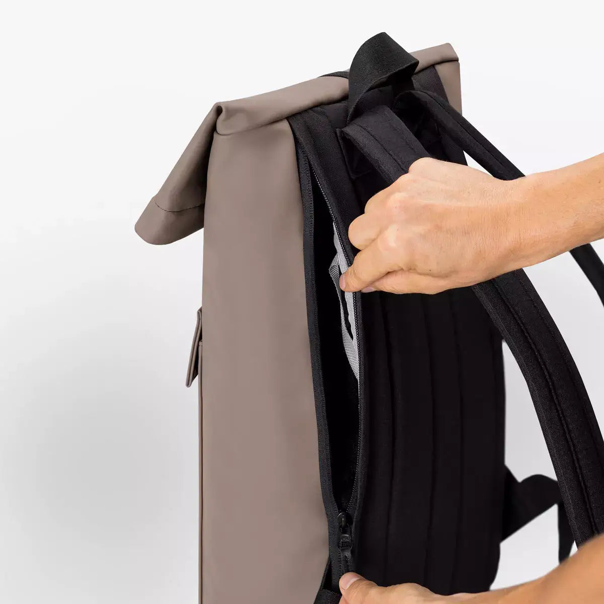 Jannik Mini Lotus Infinity Dark Sand Backpack with side zipper and roll-top closure