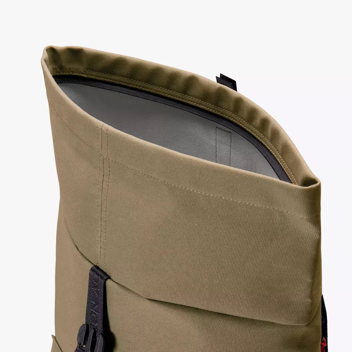 Jannik Mini Phantom Olive Reflective Backpack showing roll-top closure design and durable fabric.