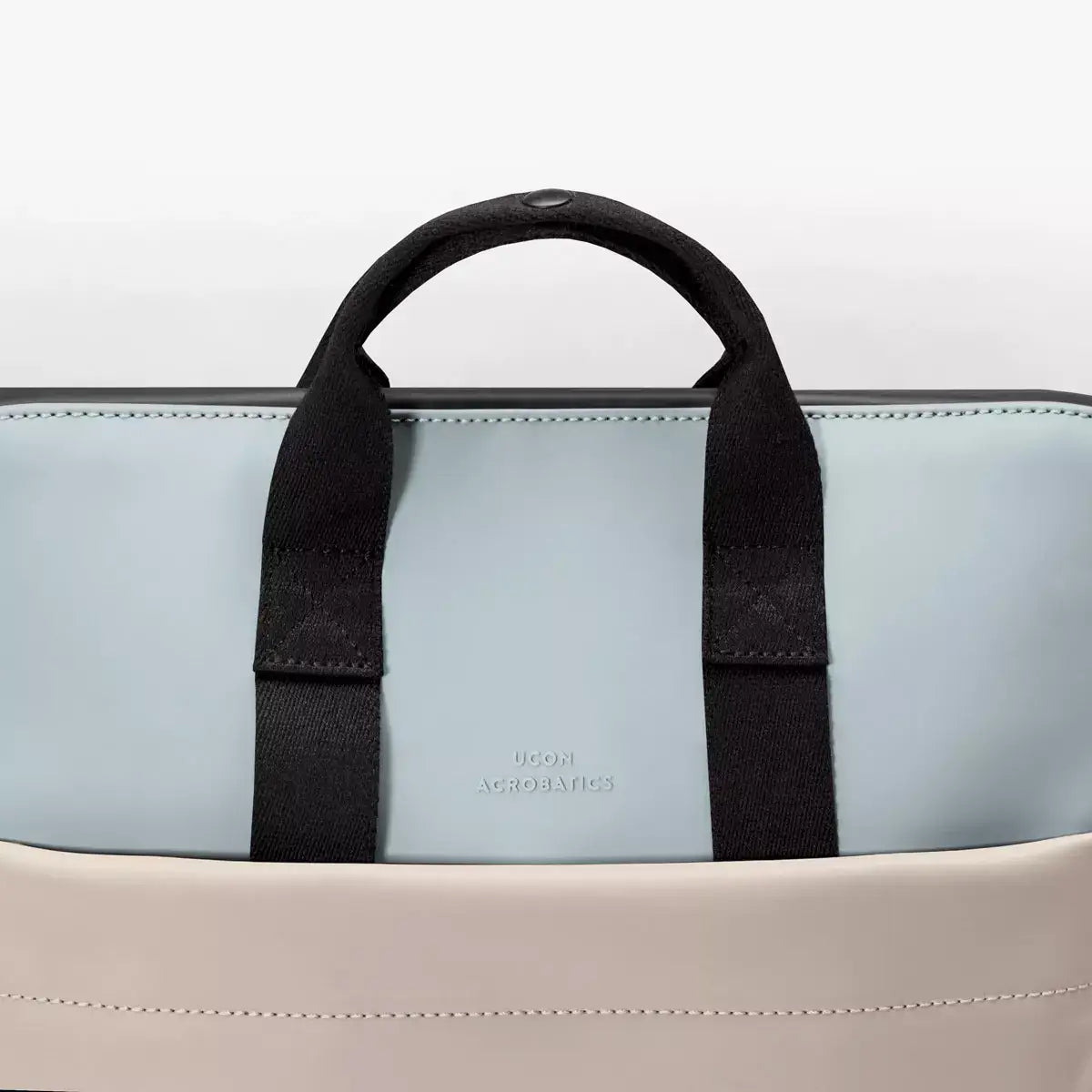 Masao Lotus Infinity Dusty Blue Light Sand Backpack with black handles and waterproof design.