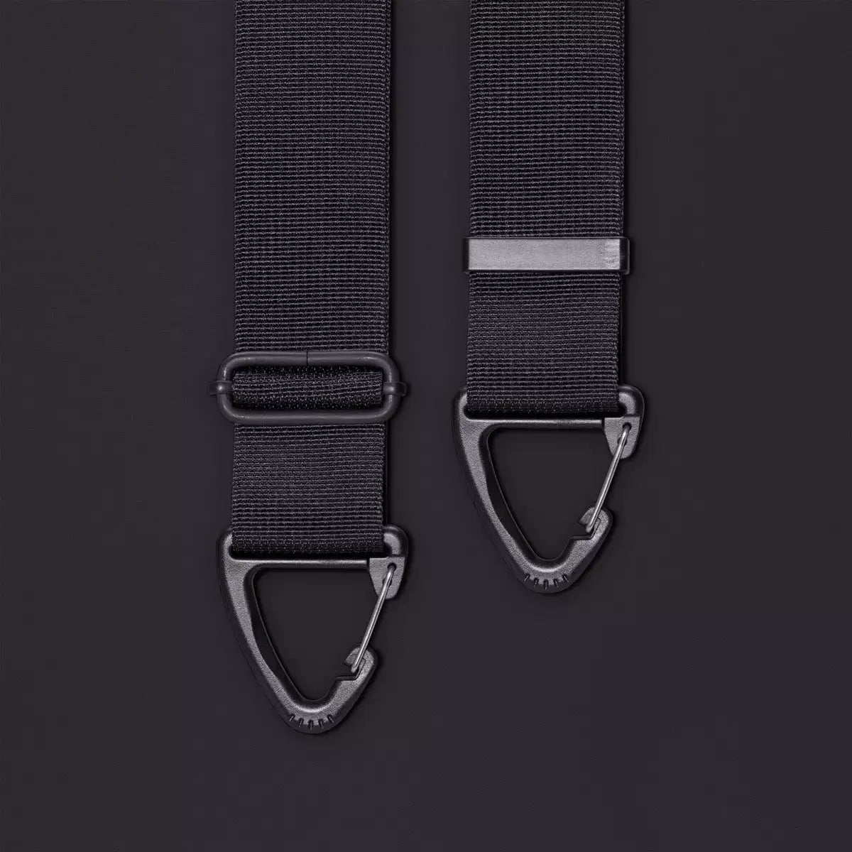 Close-up of adjustable black straps with metal clips for the Olivia Large Moss Black Shoulder Bag.