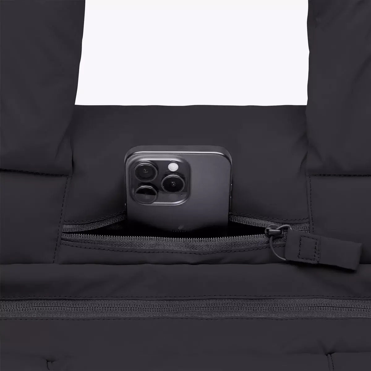 Olivia Medium Moss Black Shoulder Bag featuring a zipper pocket with a smartphone inside on a black background.