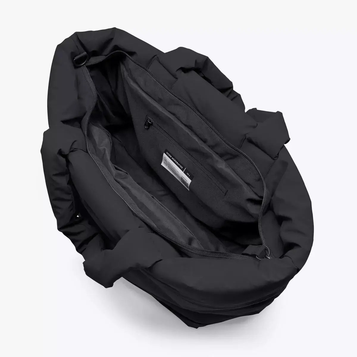 Interior view of the Olivia Medium Moss Black Shoulder Bag showing main compartment and pockets.