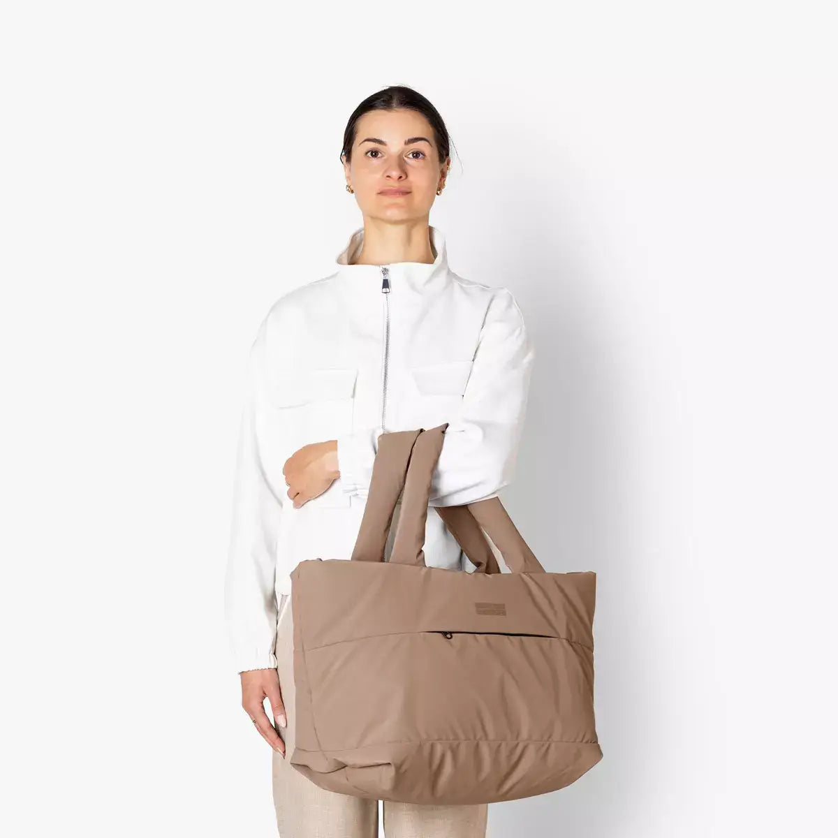 Olivia Medium Moss Earth Shoulder Bag shown on a model, highlighting its spacious and stylish design.