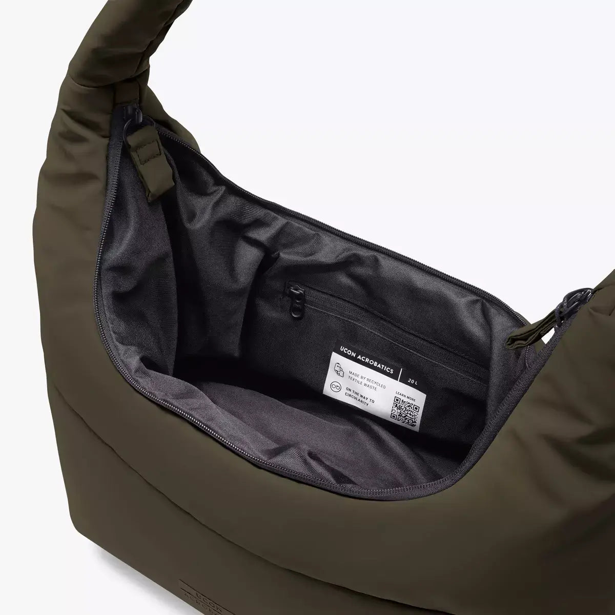 Interior view of Shota Large Moss Olive Shoulder Bag showcasing main compartment and zipper pocket.