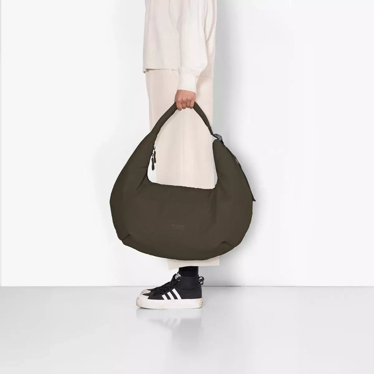 Shota Large Moss Olive Shoulder Bag displayed on a model, showing the stylish design and water-resistant material.