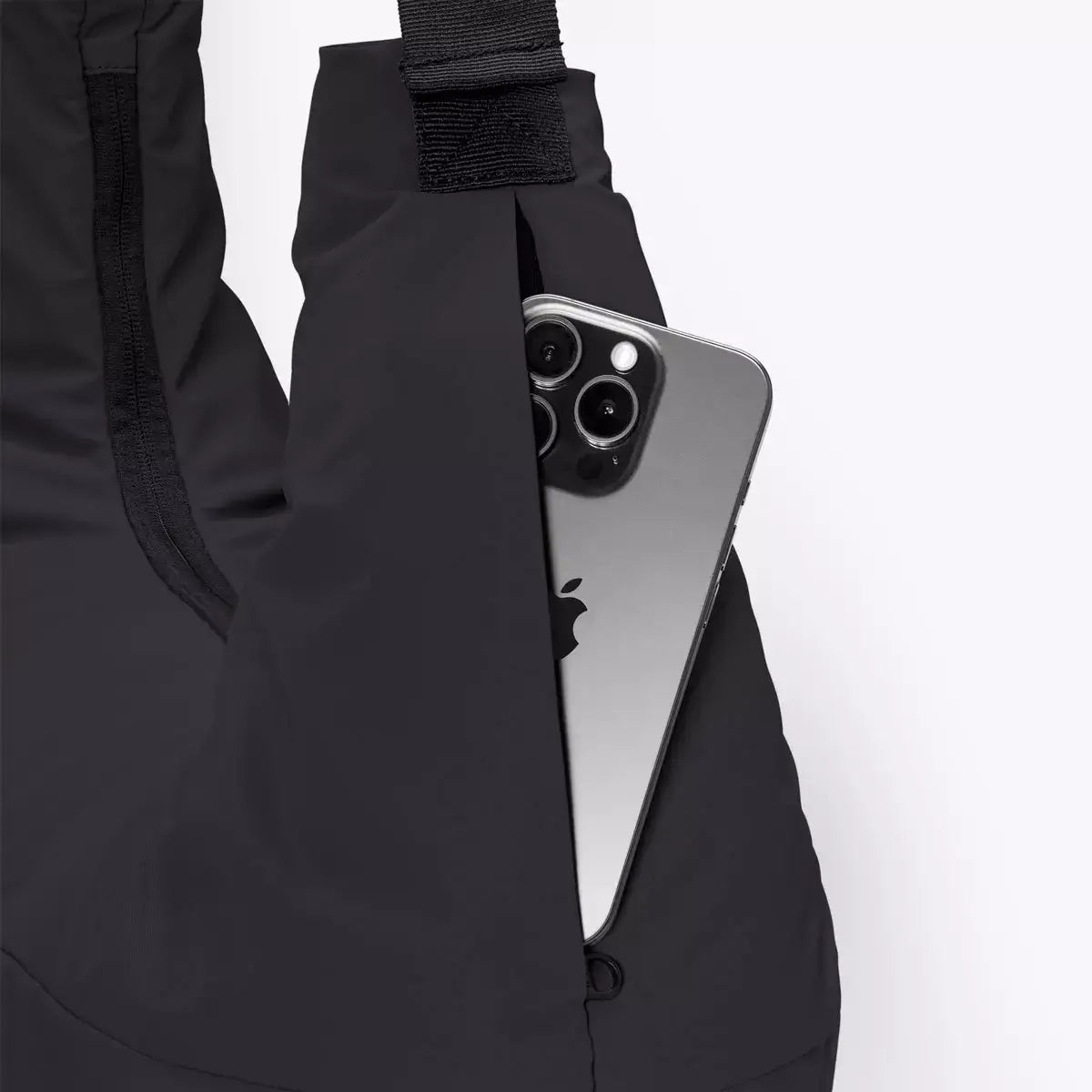 Shota Medium Moss Black Shoulder Bag featuring a hidden outer pocket with a cellphone inside.