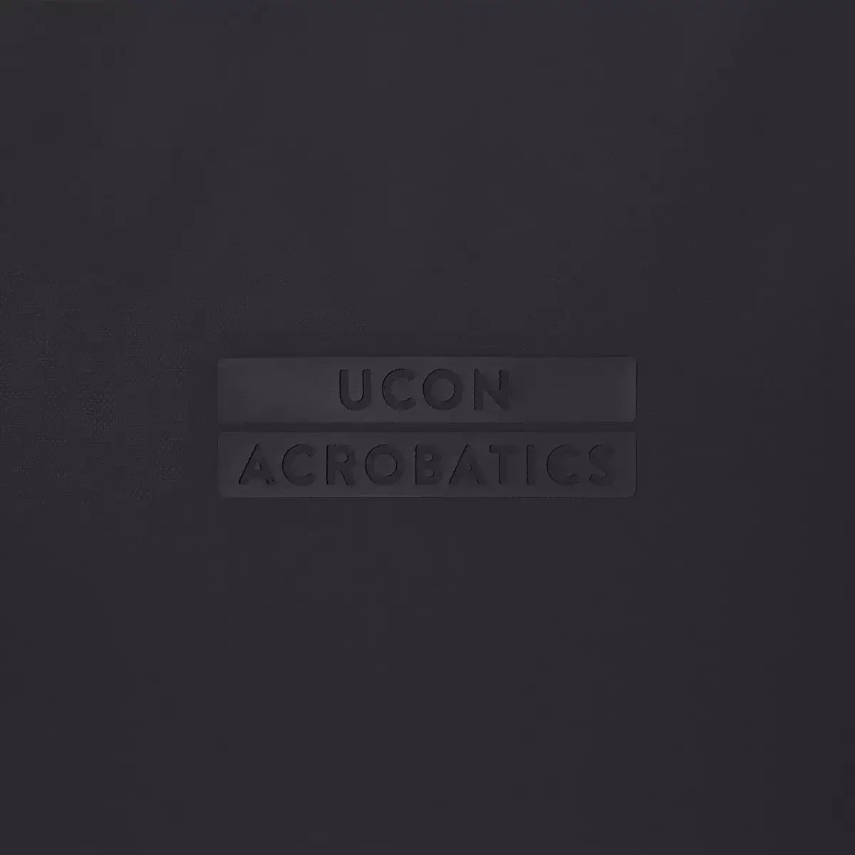 UCON ACROBATICS logo on a dark background, showcasing brand identity for eco-conscious products.