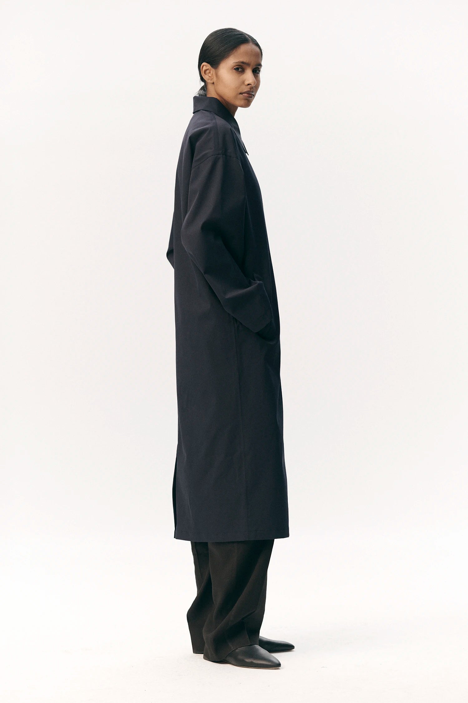 Janice B Navy Coat worn by model, showcasing waterproof and breathable fabric in a stylish silhouette.