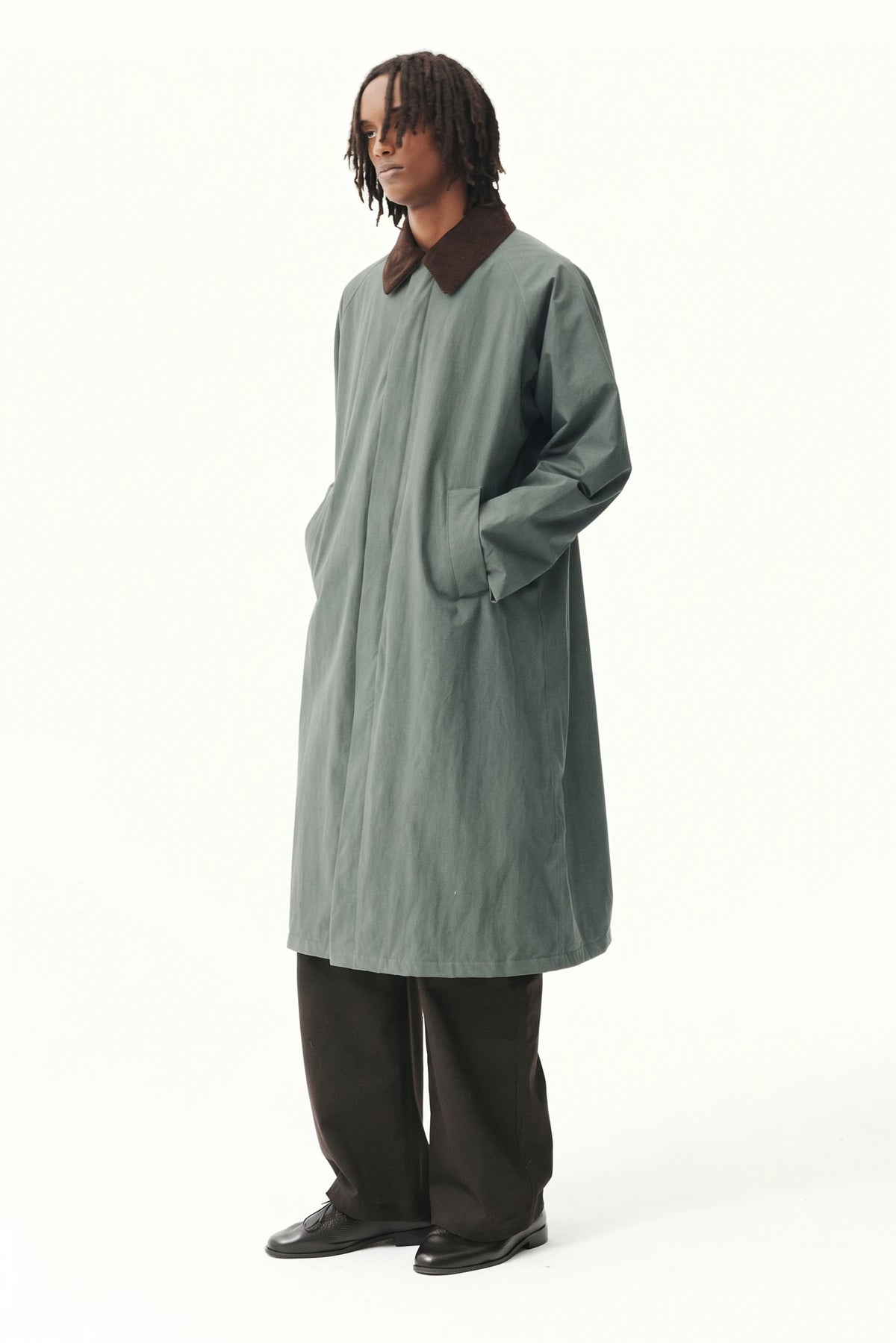 Long Coach Washed Tencel Cordu Faded Grey AW26 Coat by Welter Shelter, showcasing a model wearing the stylish waterproof coat.