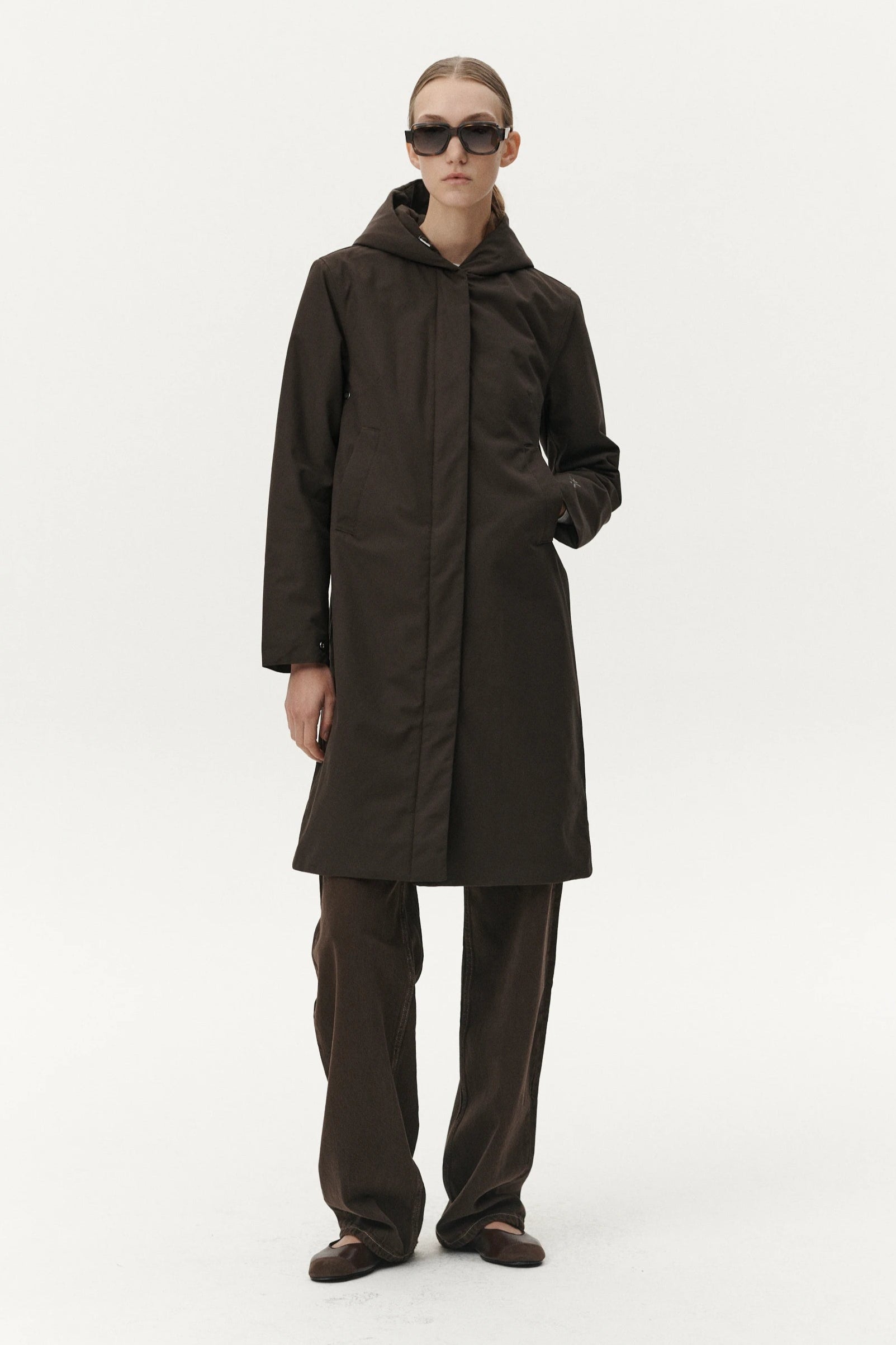 Model wearing Not So Long Tube Polyrayon Chestnut Parka in dark brown, showcasing its fashionable design and functional features.
