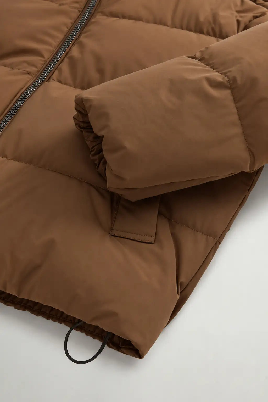 Madison Jacket Dark Earth Coat by Woolrich, showcasing premium down filling and lightweight Matt Stretch Nylon.
