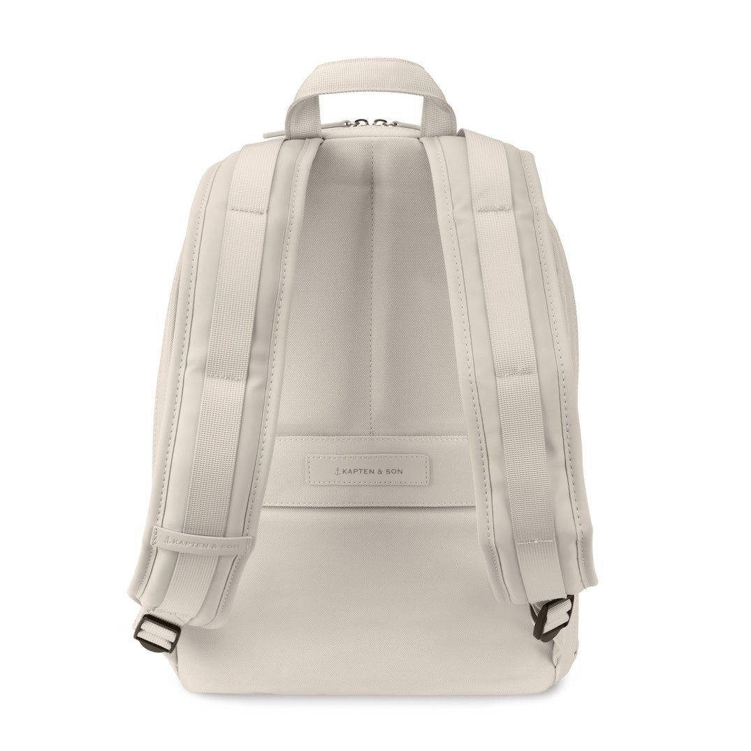 Back view of the Aalborg Sandstone Backpack showing adjustable straps and minimalist design.