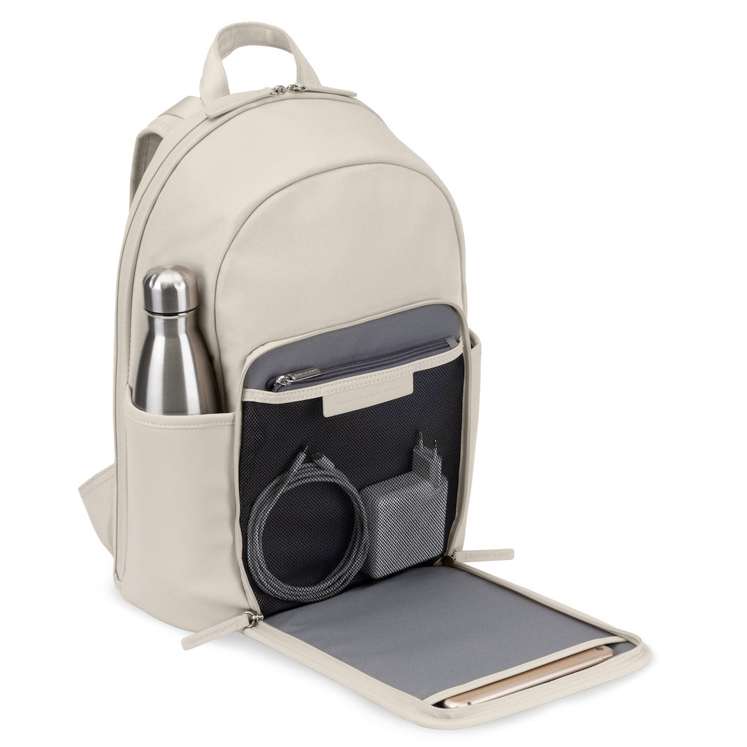 Aalborg Sandstone Backpack with a water bottle and multiple pockets for organization.