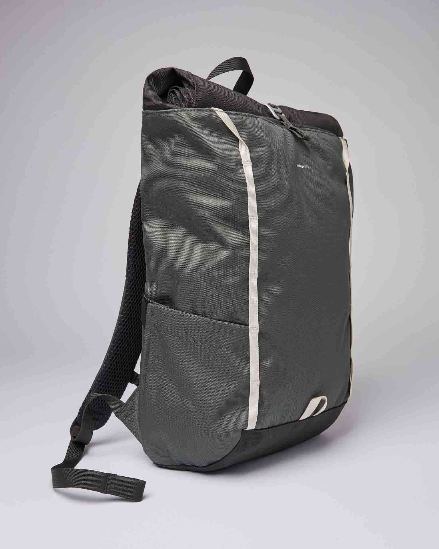 Arvid Multi Green Backpack showcasing its water-resistant design and padded straps in a stylish gray color.
