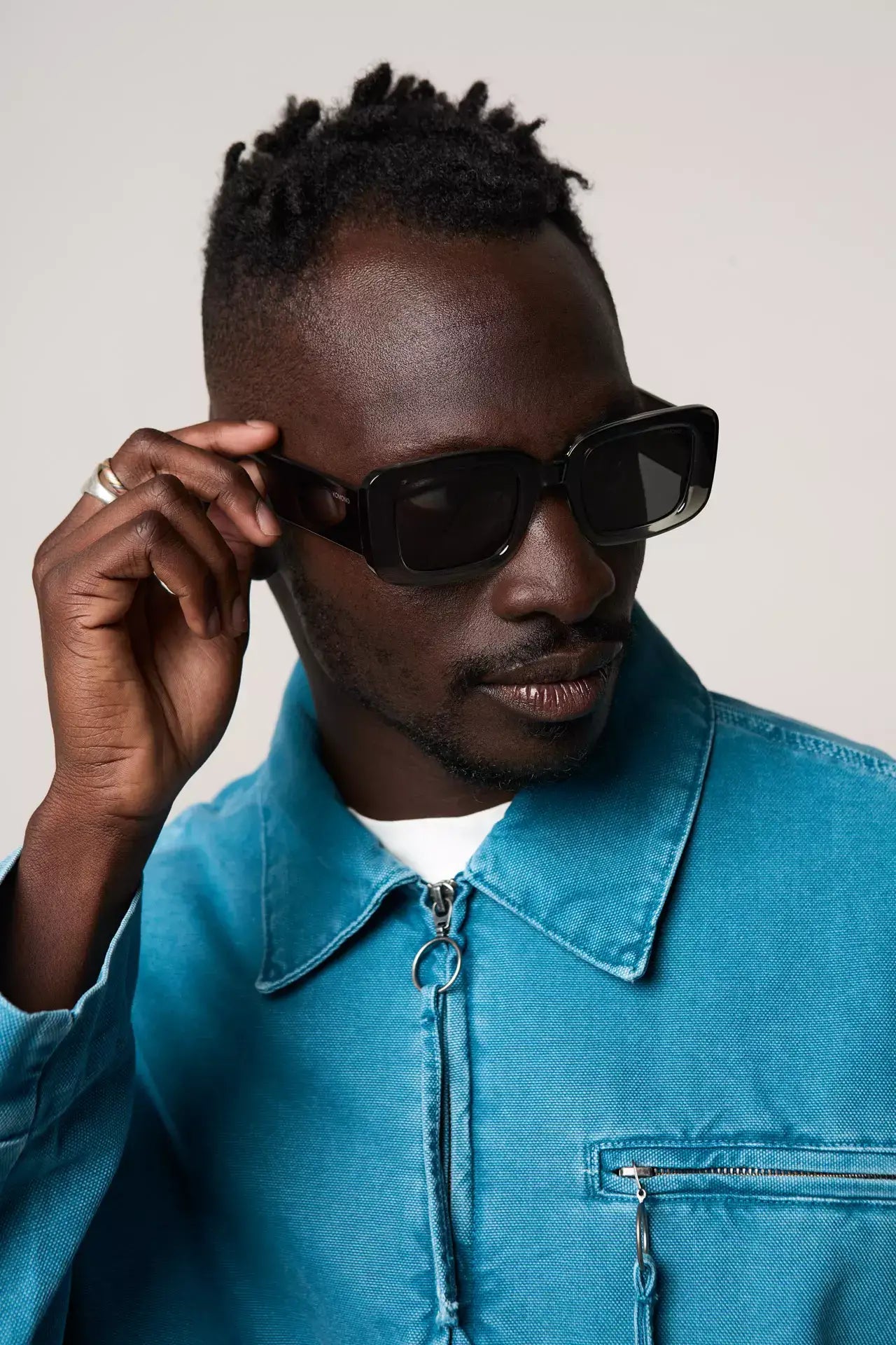 Avery Greyscale Sunglasses worn by a model, featuring a bio nylon frame and scratch-resistant lenses.