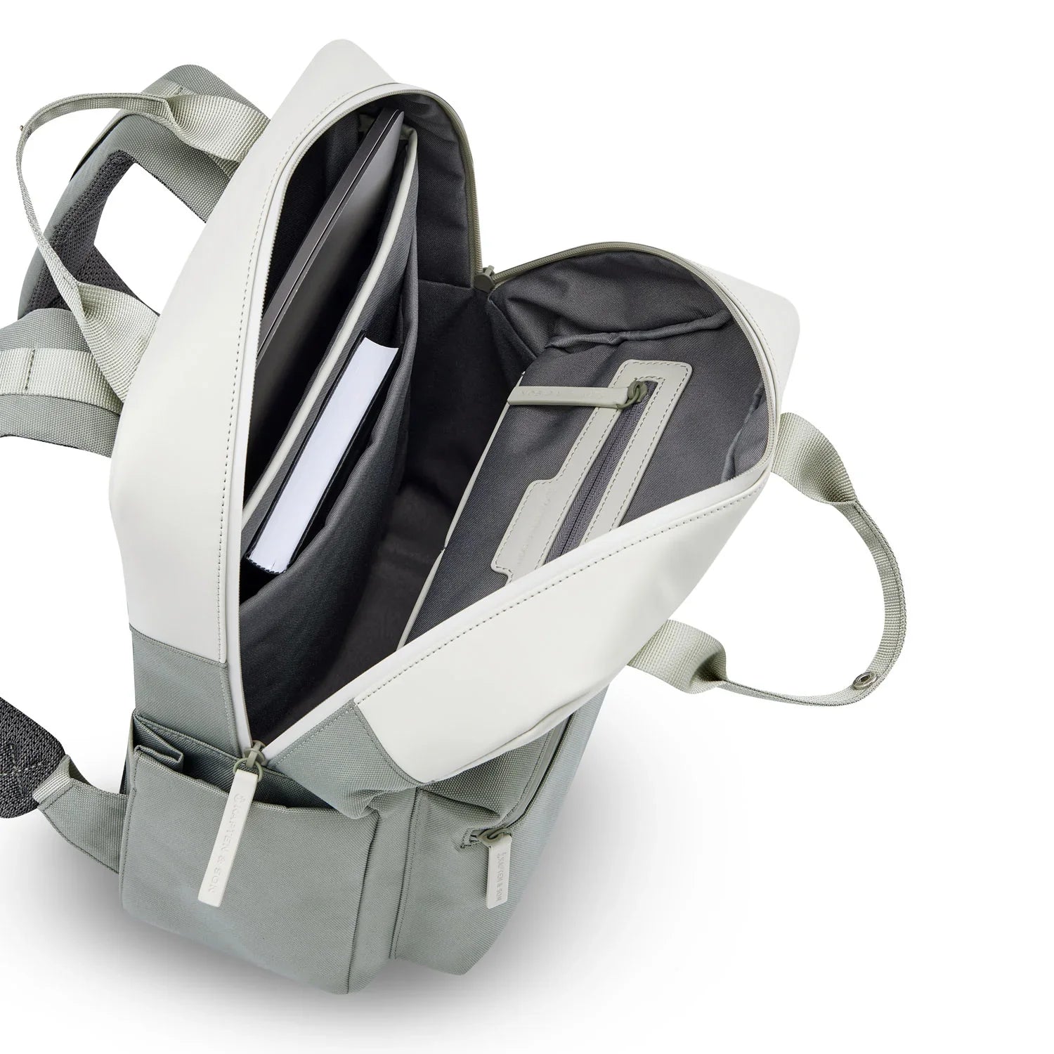 Interior view of the Bergen Pro Muted Sage Backpack showing compartments for laptop and documents.