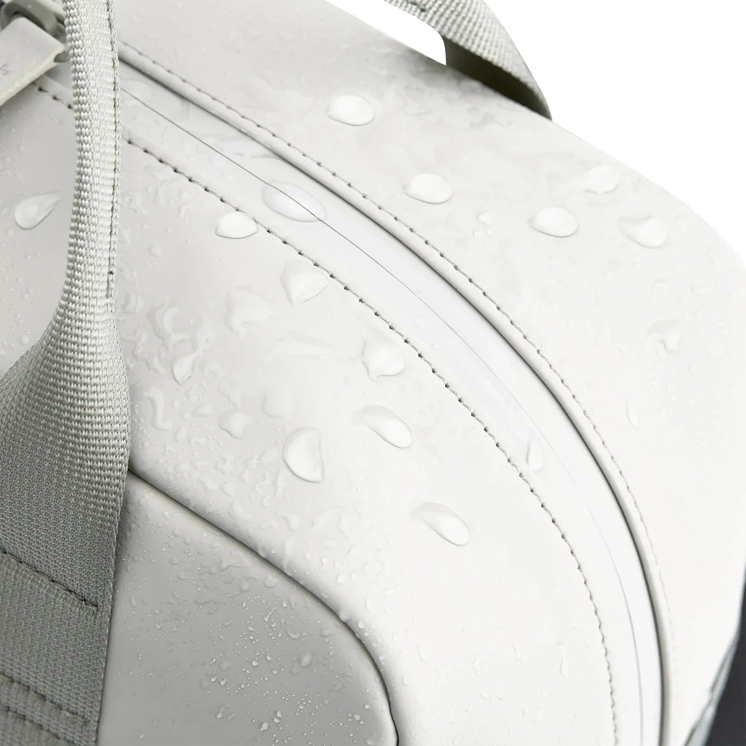 Bergen Pro Muted Sage Backpack surface showing water-resistant droplets for durability.