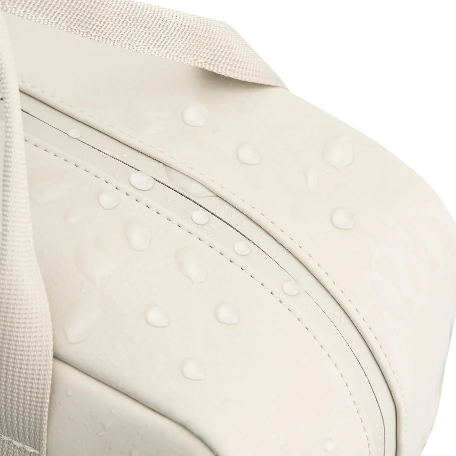 Close-up of Bergen Pro Sandstone Backpack showcasing water resistance with droplets on the surface.