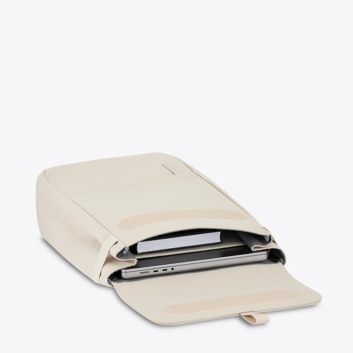 Fyn Sandstone Backpack open view showing 14 inch laptop pocket and minimalist design features