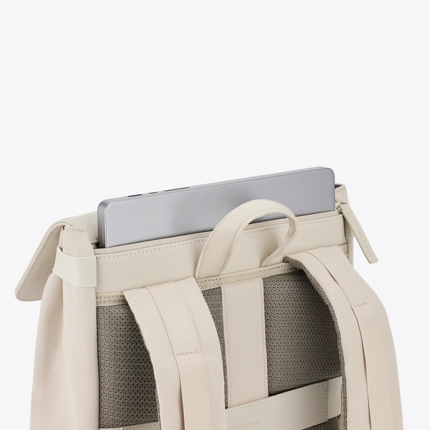 Fyn Sandstone Backpack with a laptop pocket for a 14 inch device and minimalist design.