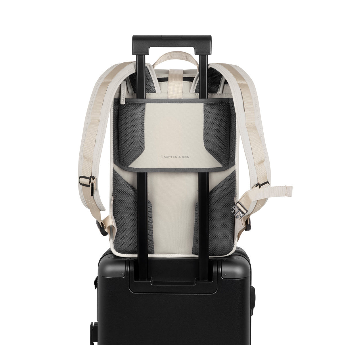 Lund Pro Sandstone Backpack on a suitcase showing ergonomic straps and roll-top access features.