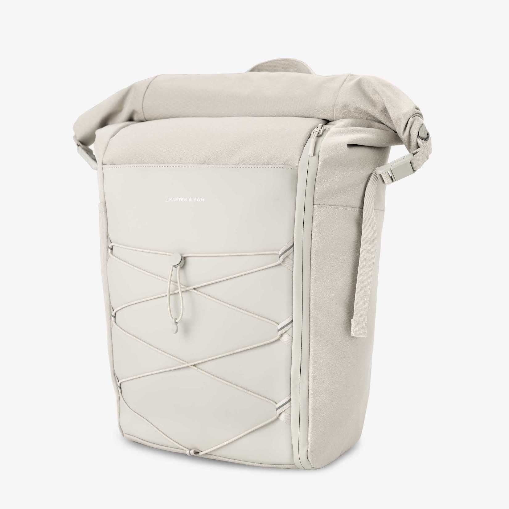 Yoho Sandstone Backpack featuring magnetic buckles, padded straps, and water-resistant material.