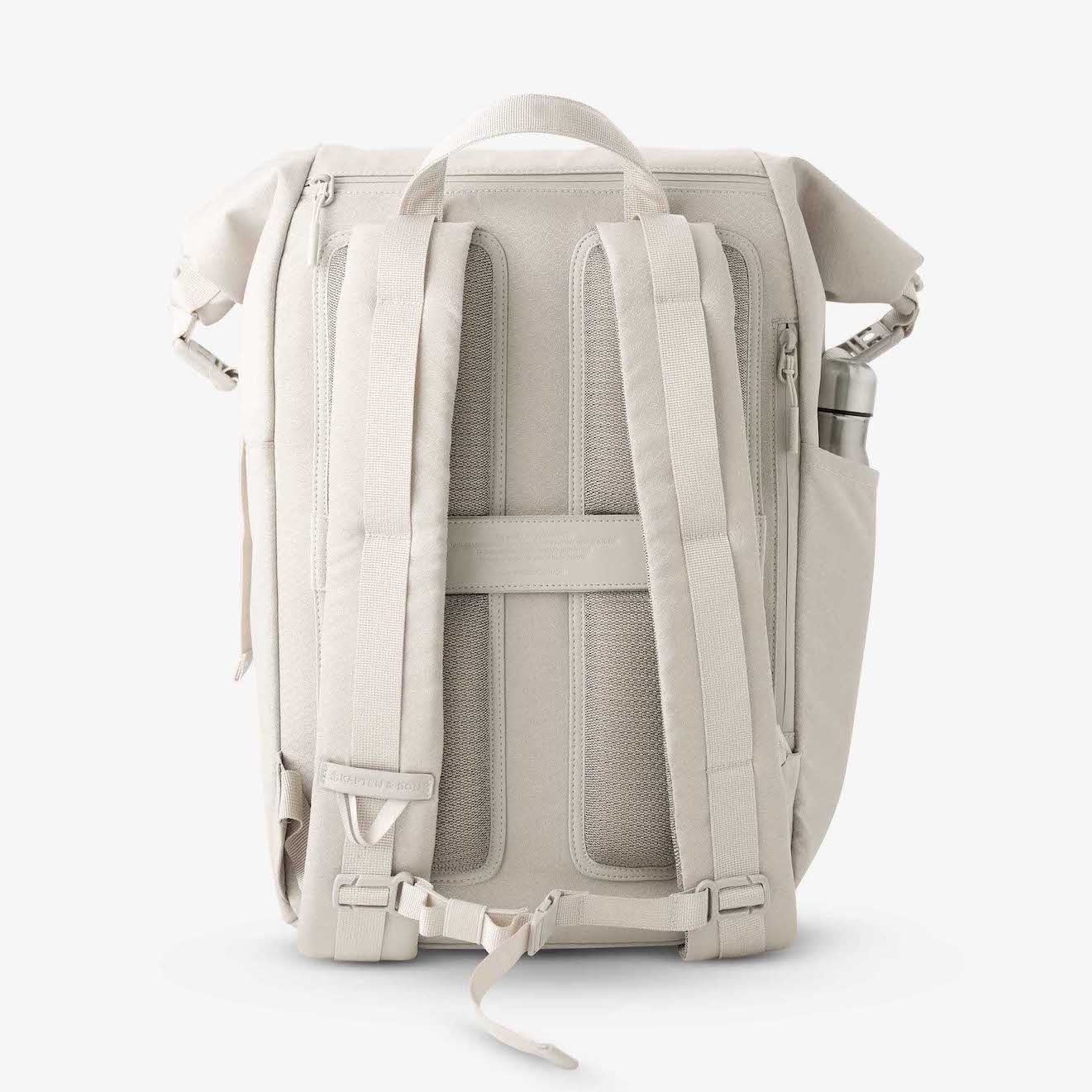 Yoho Sandstone Backpack with padded straps and back panel, featuring side zipper access and water resistant material.