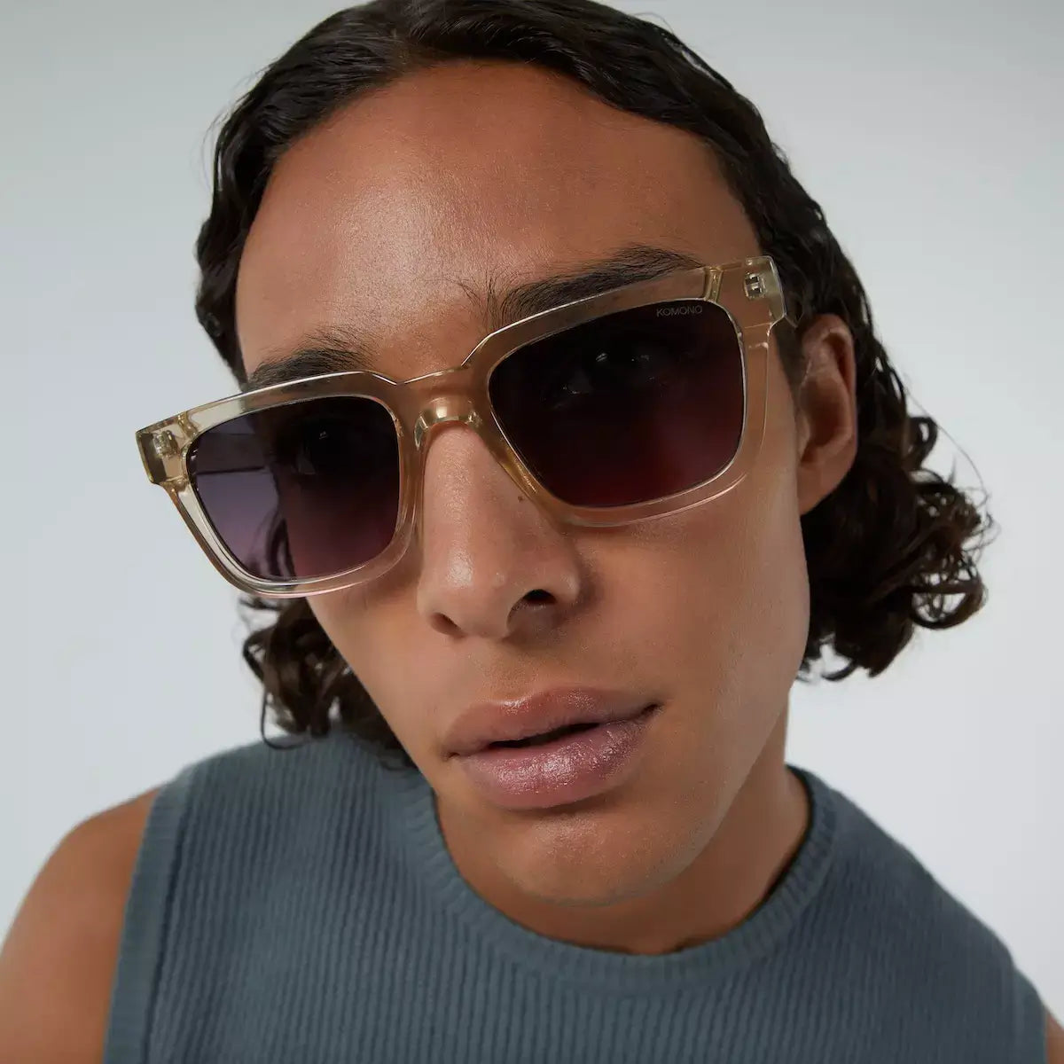 Bobby Red Sands Sunglasses shown on a model with dark shades and stylish frame, highlighting UV protection features.