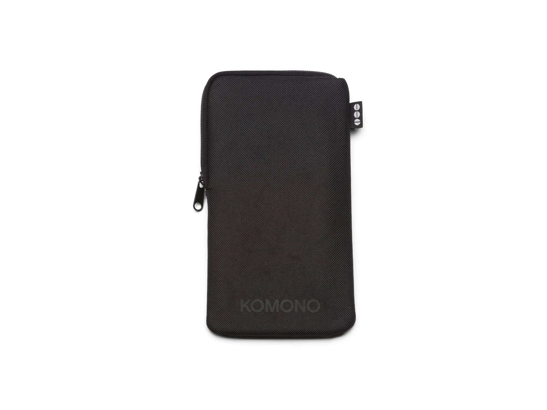 Black soft case by KOMONO for sunglasses storage and protection, featuring a zip closure.